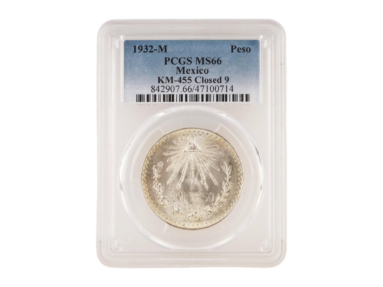 1932 MEXICAN SILVER PESO COIN GRADED BY PCGS MS66: A 1932 Mexican Silver Peso coin, graded MS66 by PCGS. It features a classic Cap and Rays design. The obverse displays the Mexican National Emblem: An eagle perched on a prickly pear cactus, holding a 