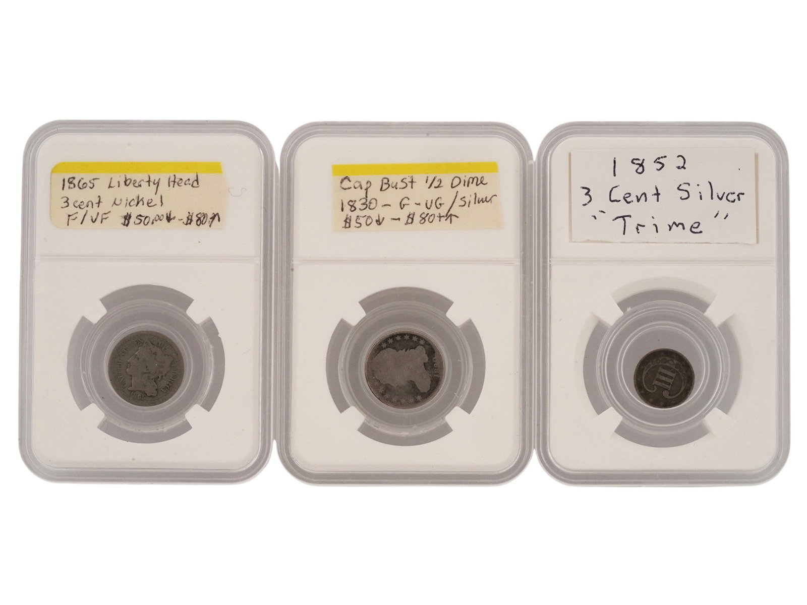 LOT OF THREE ANTIQUE 19TH C UNITED STATES COINS: A lot of three antique 19th-century United States coins, each protected in a modern slab-style holder. The set includes an 1865 Liberty Head 3-Cent Nickel, an 1830 Capped Bust Half Dime Silver coin, a