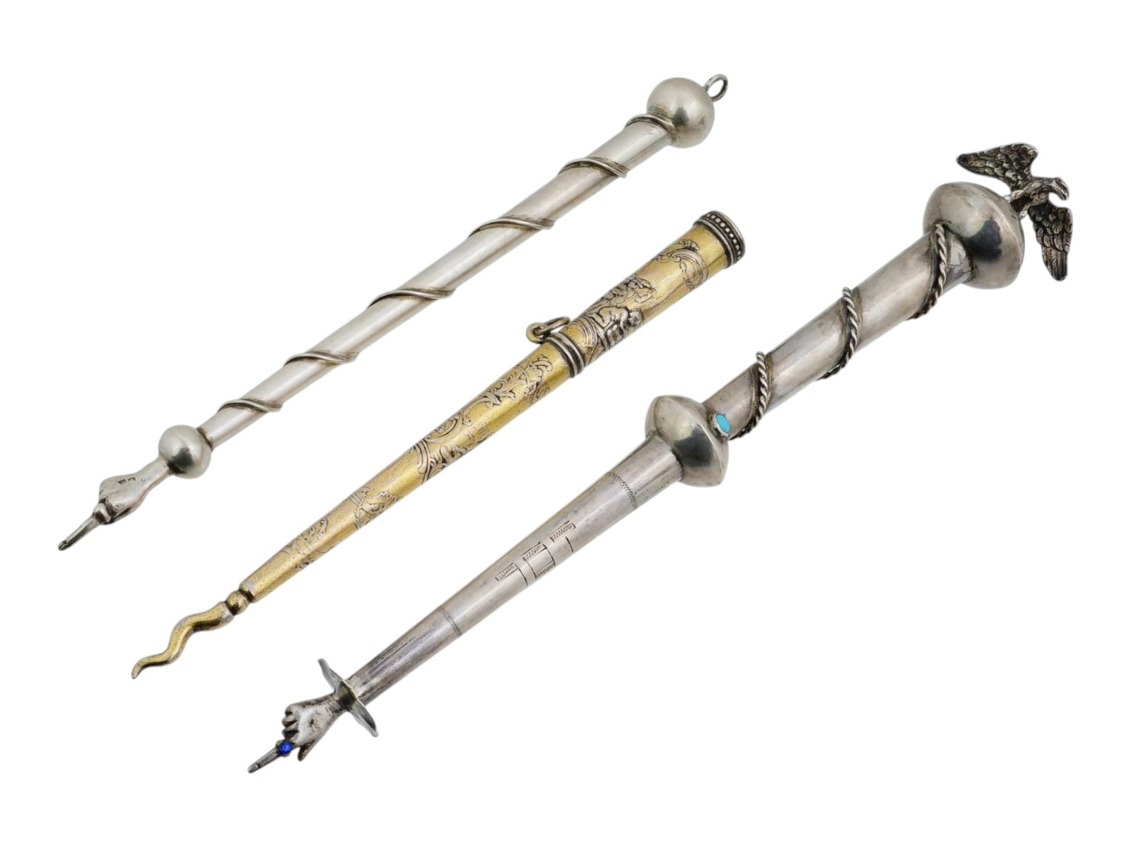 3 CONTINENTAL AND RUSSIAN SILVER TORAH POINTERS: A lot of three vintage Judaica continental and Russian silver Torah pointers. Two of them feature classical designs with twisted elements on the body and terminate in an index finger at the tip. The C