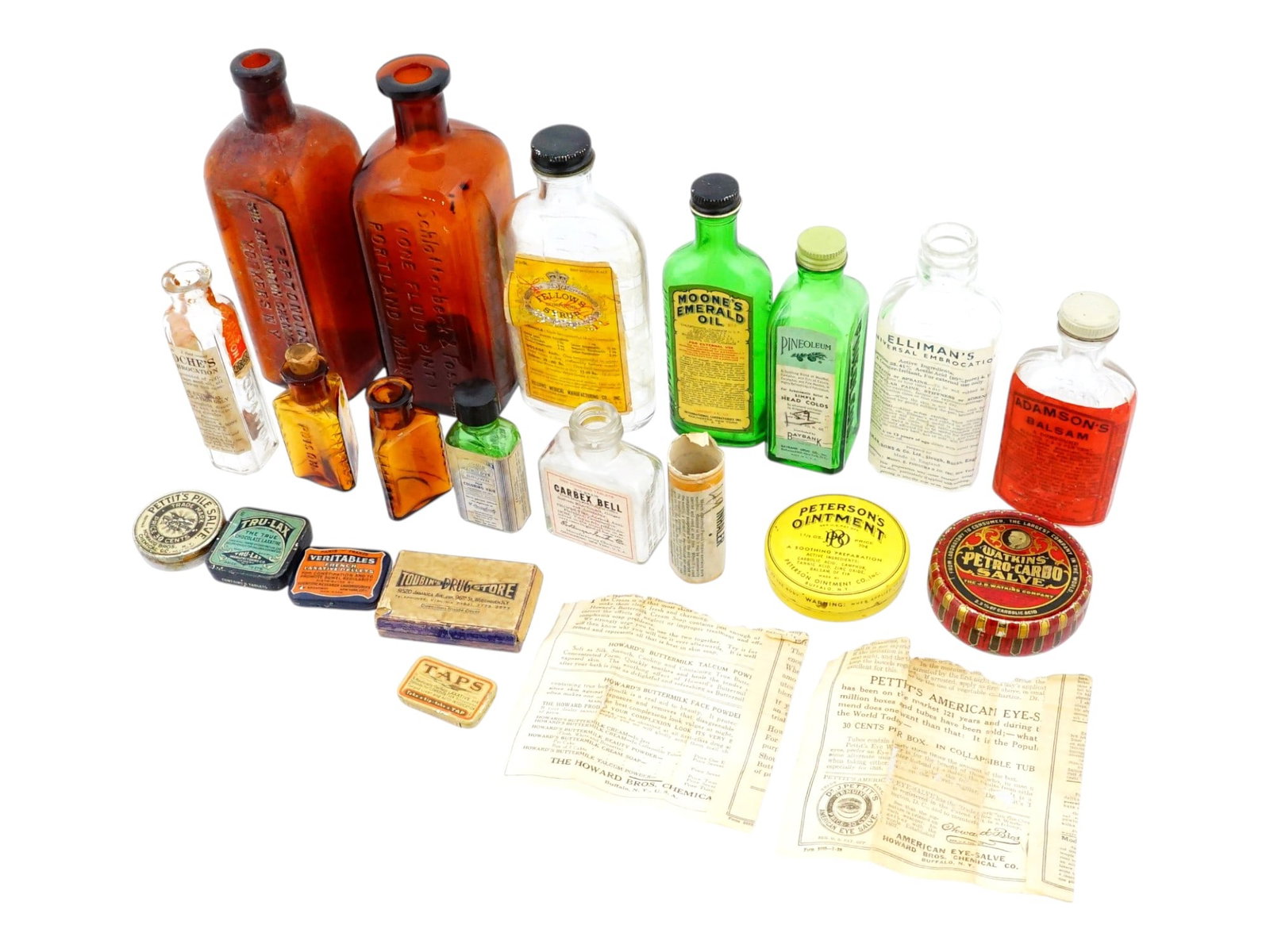 LOT OF EARLY TO MID 20TH C APOTHECARY BOTTLES W BOXES: A collection of early to mid-20th-century apothecary bottles such as Moones Emerald Oil, Pineoleum, Adamsons balsam, Fellows syrup, and Ellimans, Peptonoids, The Arlington Chemical Co., Schlotterbeck 
