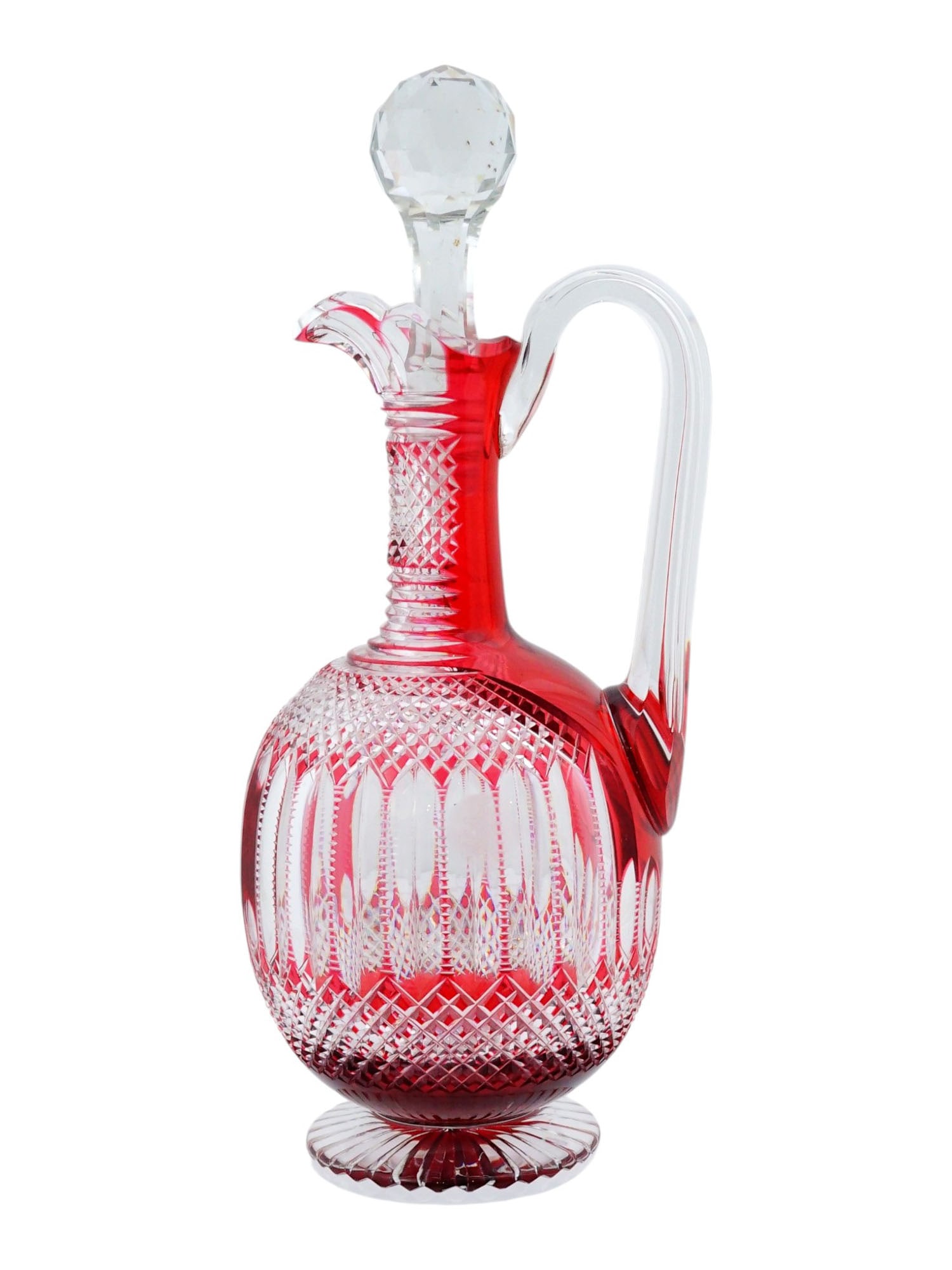 VINTAGE FRENCH RUBY RED CUT TO CLEAR CRYSTAL CLARET JUG: A vintage French ruby red cut-to-clear crystal claret jug in the celebrated Trianon pattern by Saint-Louis. The design features elegant vertical flute cuts framed by delicate diamond-point bands. Dati