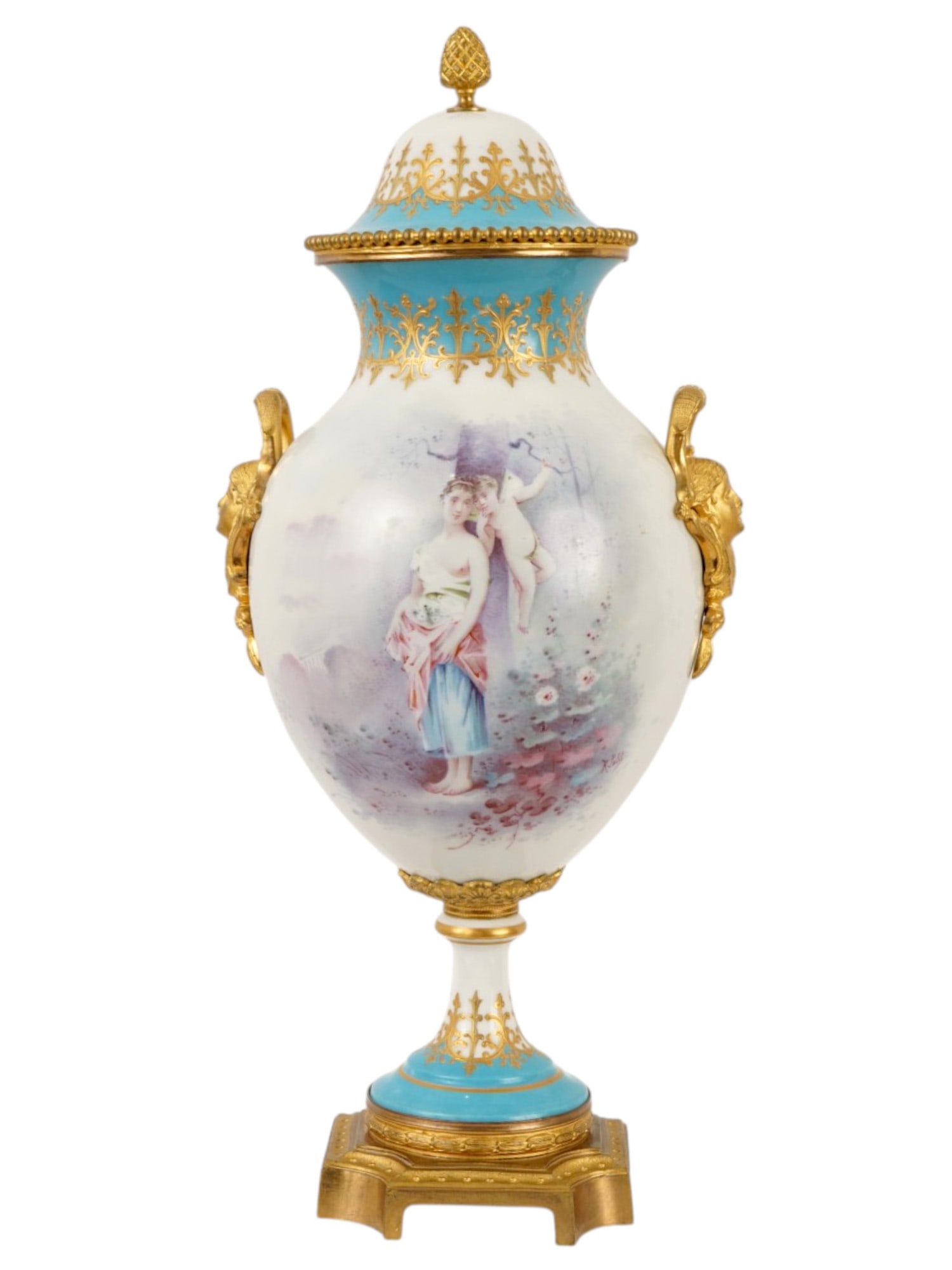 ANTIQUE FRENCH SEVRES PORCELAIN AND GILT BRONZE VASE: An antique 19th century French Sevres porcelain and gilt bronze hand painted covered urn or vase featuring a vibrant lavender ground adorned with elaborate raised gilt foliate and scrollwork. The obve