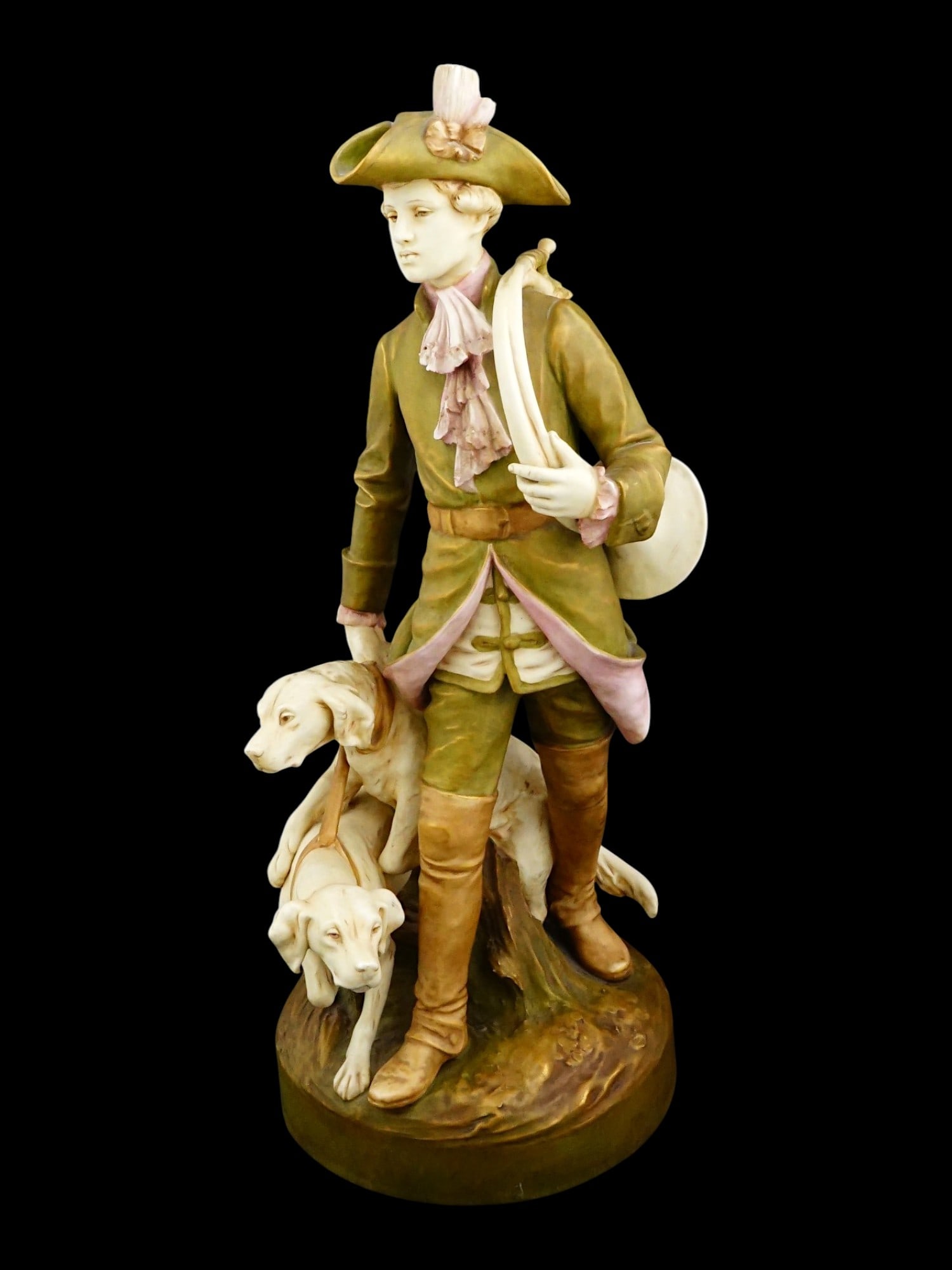 LARGE VINTAGE ROYAL DUX BISQUE PORCELAIN FIGURAL GROUP: A large vintage Royal Dux bisque porcelain figural group depicting a hunter accompanied by his dogs. Dating to the 1970s. Vintage Porcelain Figures And Art Collectibles. THIS LOT IS ELIGIBLE FO