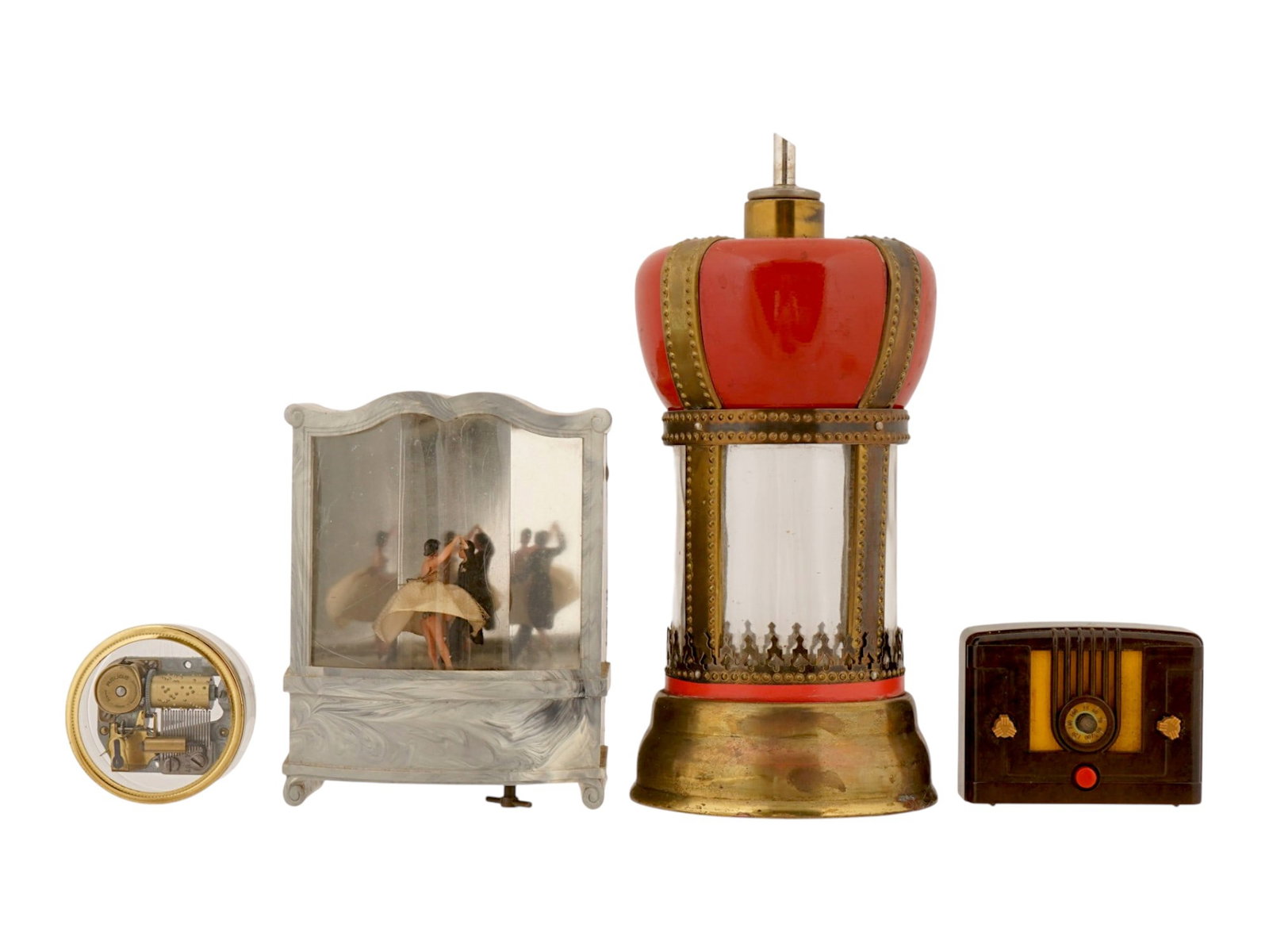 VINTAGE REUGE PLEASANT COMPANY CODY MUSIC BOXES: A lot of vintage music boxes. Cody Musical Creations box with a turning pair of dancers. Crown-shaped music box, marked Japan on the bottom. Miniature battery-powered radio by Pleasant Company. Separa