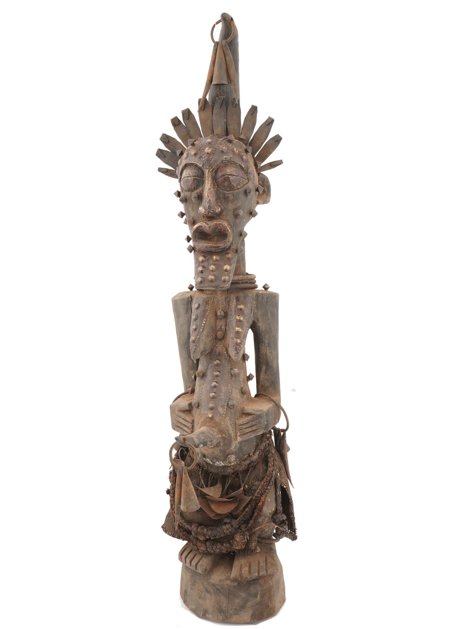 AFRICAN CARVED WOODEN SONGYE POWER FIGURE FROM CONGO: An African Songye power figure from Congo featuring a hand-carved wooden sculpture created as a spiritual mediator between the living and ancestral forces. Such figures were activated by a ritual spec