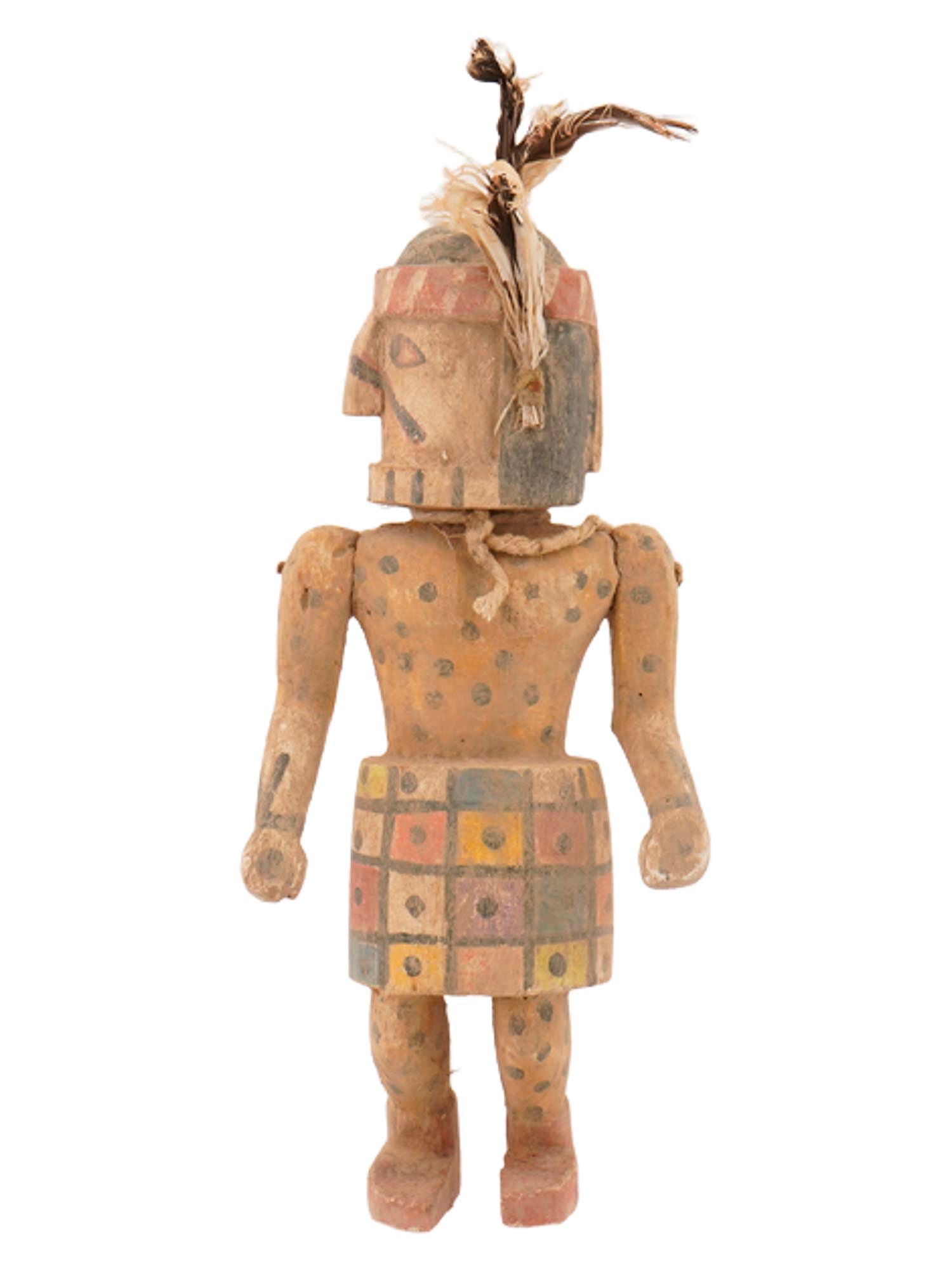 VINTAGE AMERICAN HANDCRAFTED WOODEN DOLL FIGURINE: A vintage American handcrafted and painted wooden doll figurine of a man. This life-size figure features articulated limbs, a polychrome dotted pattern throughout the body, and feathers on the head. H