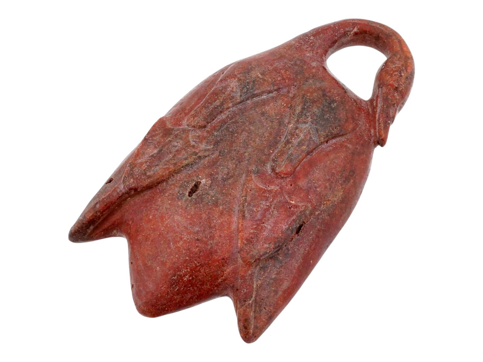 ANCIENT EGYPTIAN STONE DUCK COSMETIC CONTAINER: An ancient Egyptian cosmetic container carved from stone. The container is beautifully carved from red stone and modeled with a duck motif. The oval top features a recess for cosmetics and a handle sh