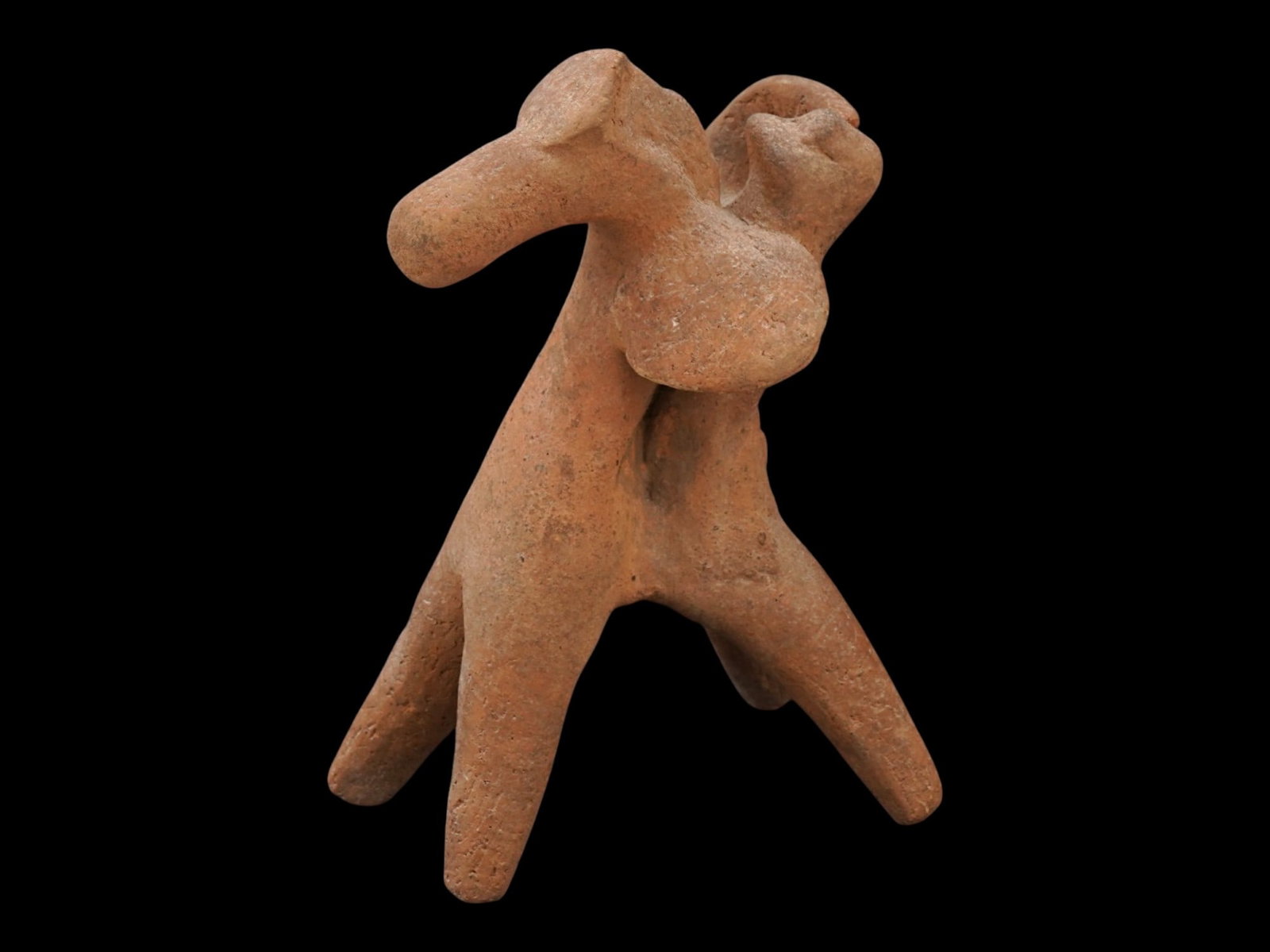 ANCIENT GREEK TERRACOTTA FIGURE OF A WARRIOR W A SHIELD: An ancient Greek terracotta figure, depicting a mounted warrior with a shield and dating approximately from 600 to 400 BC. Modeled in fired clay, the sculpture portrays a horseman in dynamic form, ref