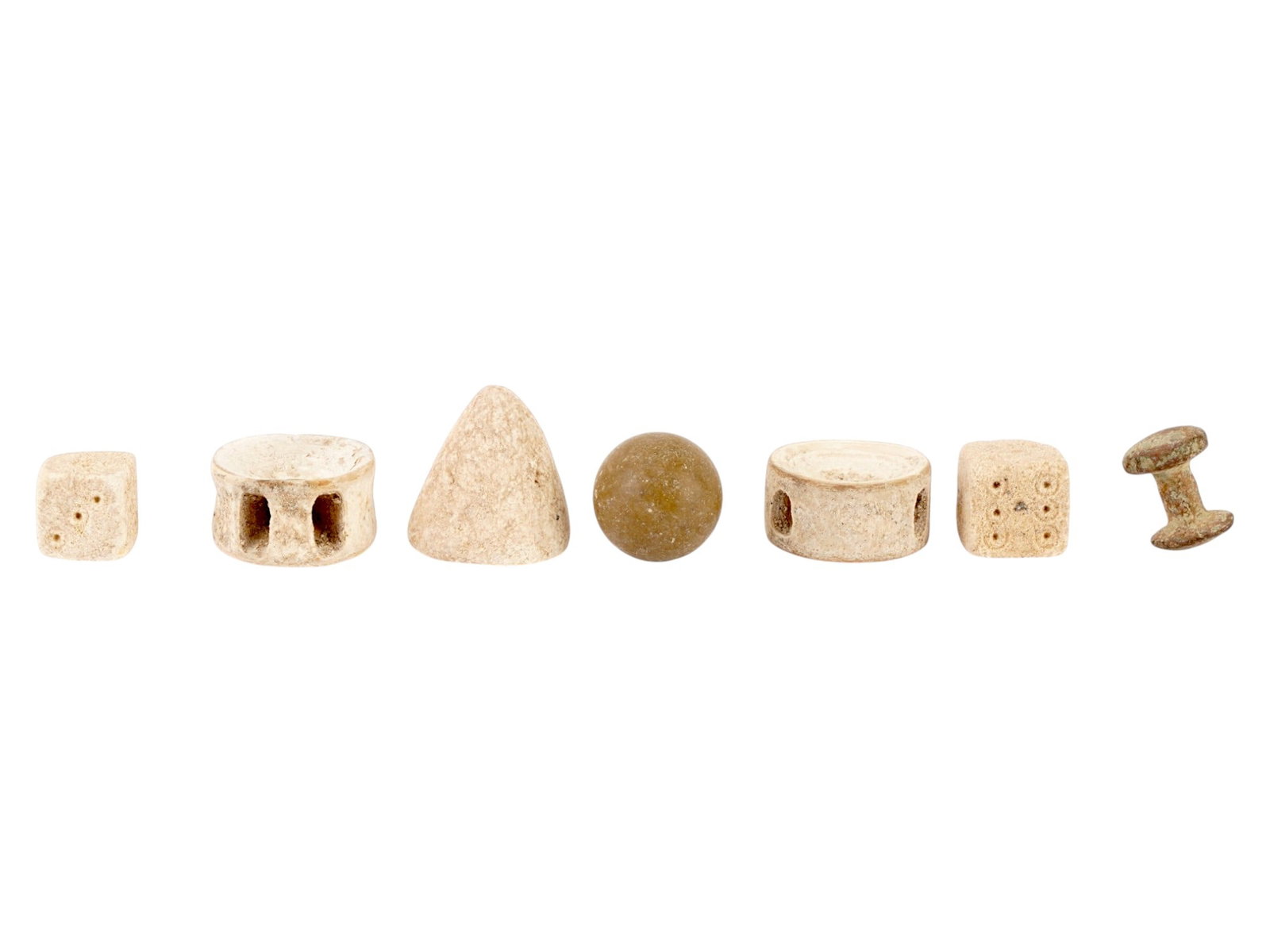 LOT OF ANCIENT ROMAN GAMING PIECES 100 AD TO 700 AD: A group of seven ancient Roman and Earlier gaming pieces. Circa: 100 to 700 AD. The lot includes handcrafted gaming pieces, including dice of various shapes made from natural materials. Historical Col