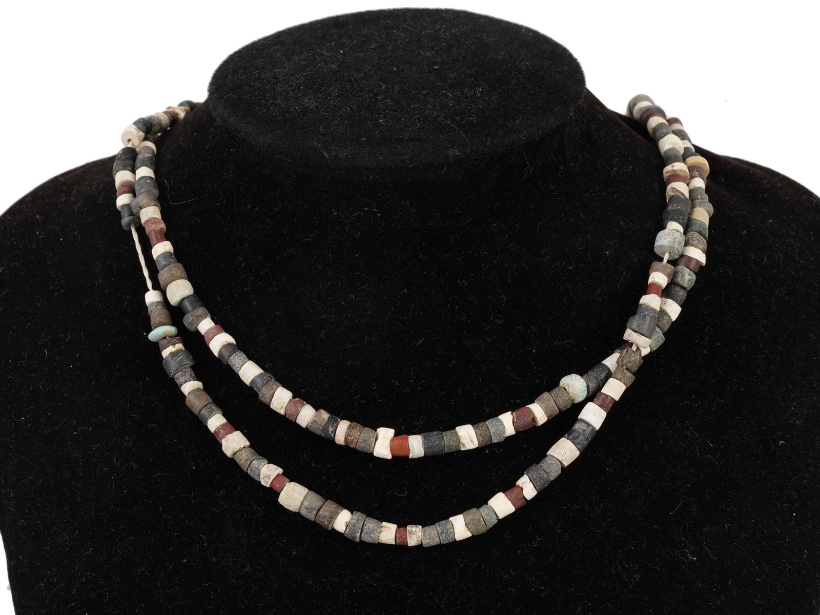 ANCIENT EGYPTIAN STEATITE AND FAIENCE BEAD NECKLACE: An ancient Egyptian bead necklace, dating to the Late Period, circa 700 to 200 BC. Composed of steatite and faience beads, materials widely used in Egyptian adornment and amuletic jewelry. Ancient Egy