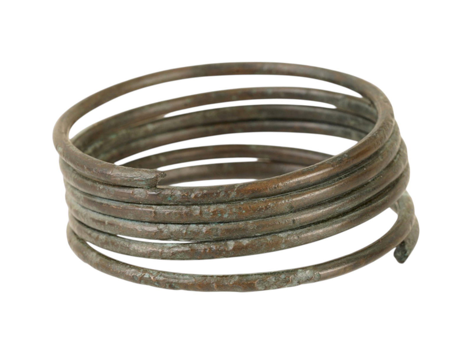 ANCIENT GREEK BRONZE SPIRAL BRACELET CA 600 TO 400 BC: An ancient Greek bronze spiral bracelet, dating circa 600 to 400 BC. Served as both a decorative ornament and a personal status accessory worn in daily life. Such pieces were common in the ancient Med