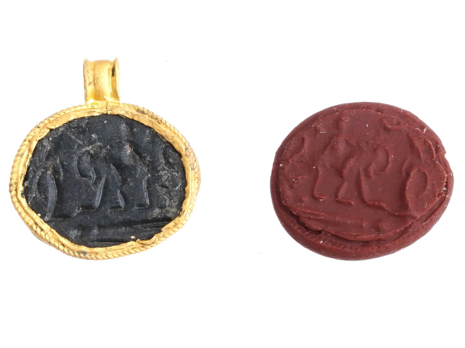 ANCIENT ROMAN GOLD AND BRONZE INTAGLIO 100 TO 300 AD: An ancient Roman pendant crafted in gold and bronze, dating to approximately 100 to 300 AD. The piece features an engraved central image representing a scene with a woman riding an animal facing a tre