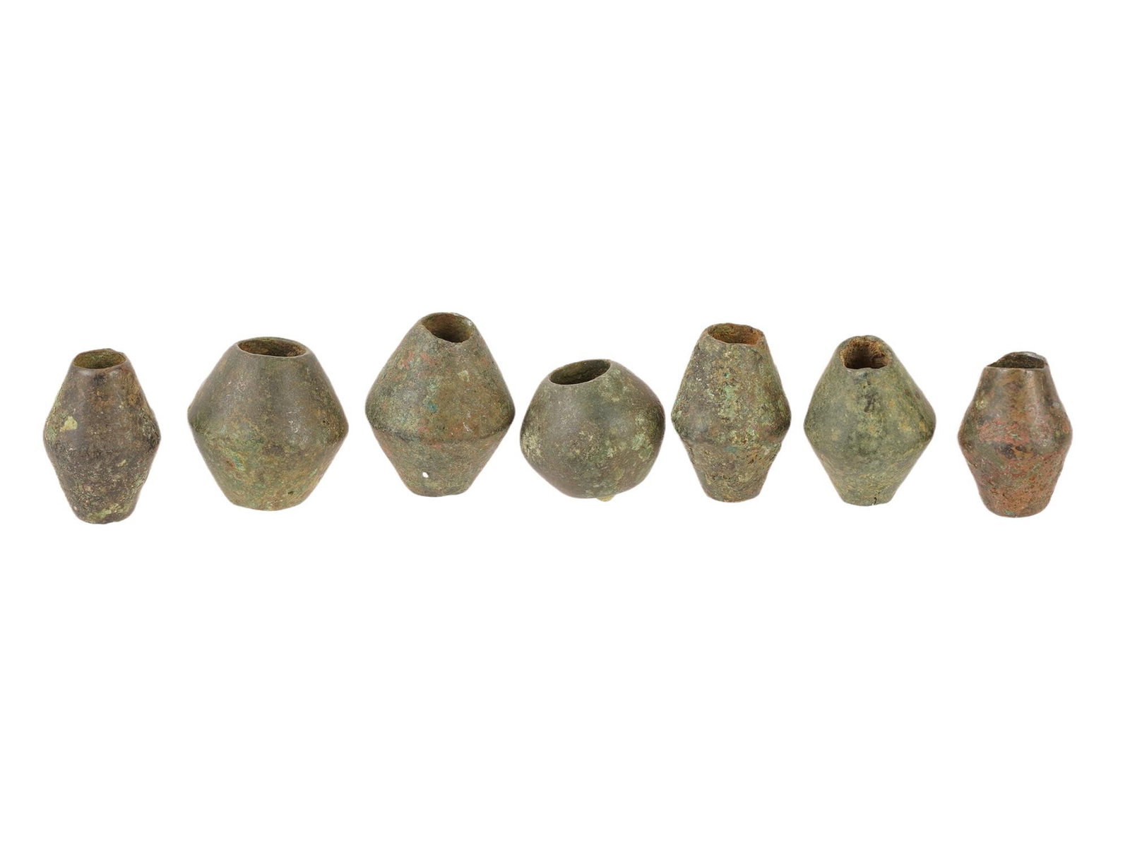 GROUP OF ANCIENT NEAR EASTERN BRONZE BEADS: A group of ancient Near Eastern bronze beads dating to the 2nd millennium BC, during the Middle to Late Bronze Age. Such beads were typically strung as necklaces, bracelets, or incorporated into garme