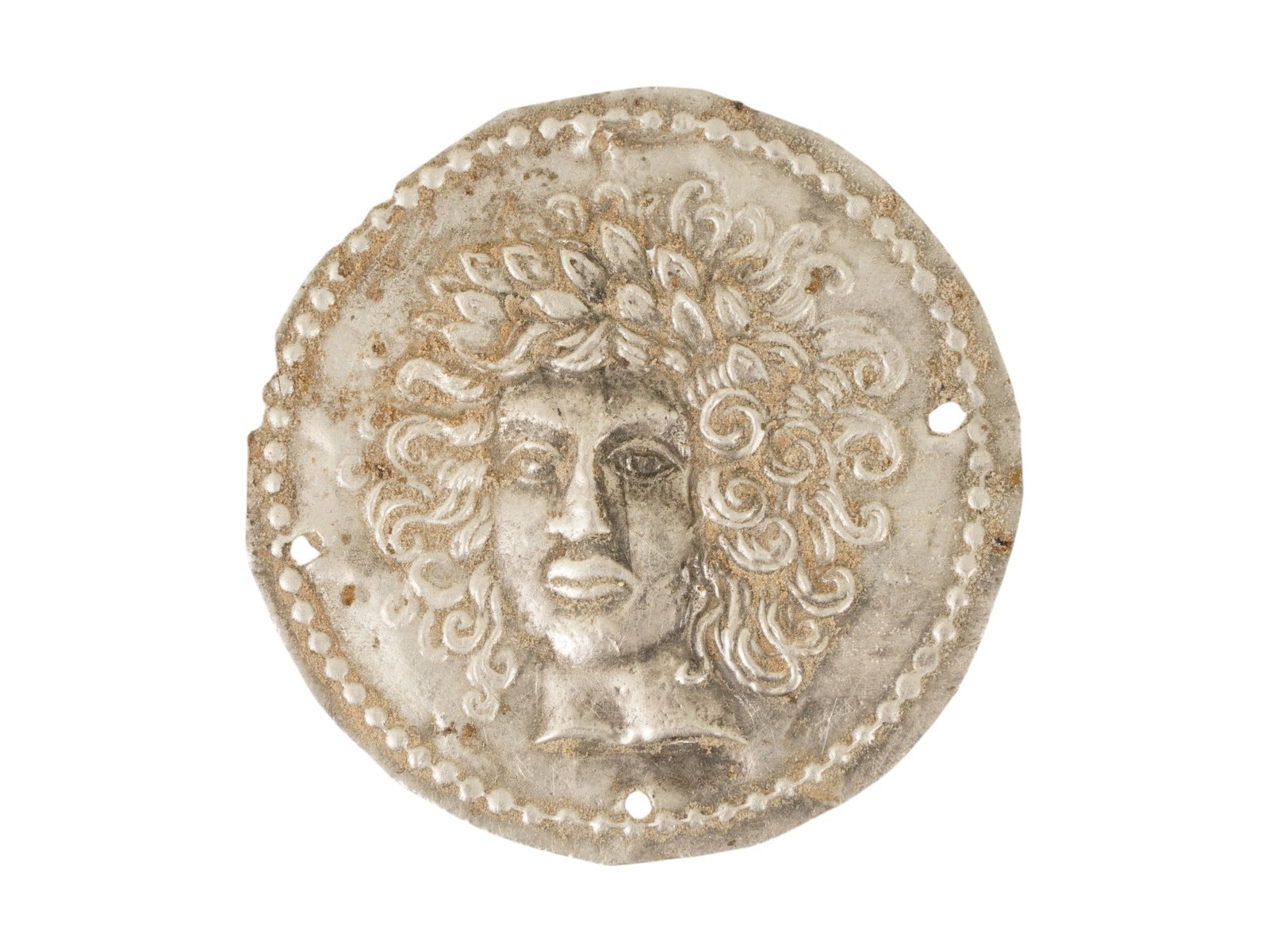 ANCIENT GRECO ROMAN SILVER PLAQUE MEDUSA GORGO: An ancient Greco Roman silver plaque, presumably a medallion, dating from 200 BC to 100 AD. The piece features an embossed round design depicting the face of Medusa Gorgo, showcasing the mythological 