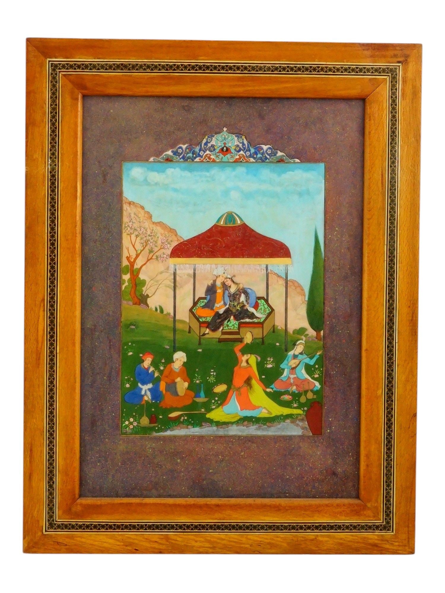 ANTIQUE PERSIAN MINIATURE MIXED MEDIA PAINTING: An antique Persian miniature mixed media painting in the Safavid revival style on a natural material panel. The painting depicts a colorful court scene with figures seated beneath a pavilion and