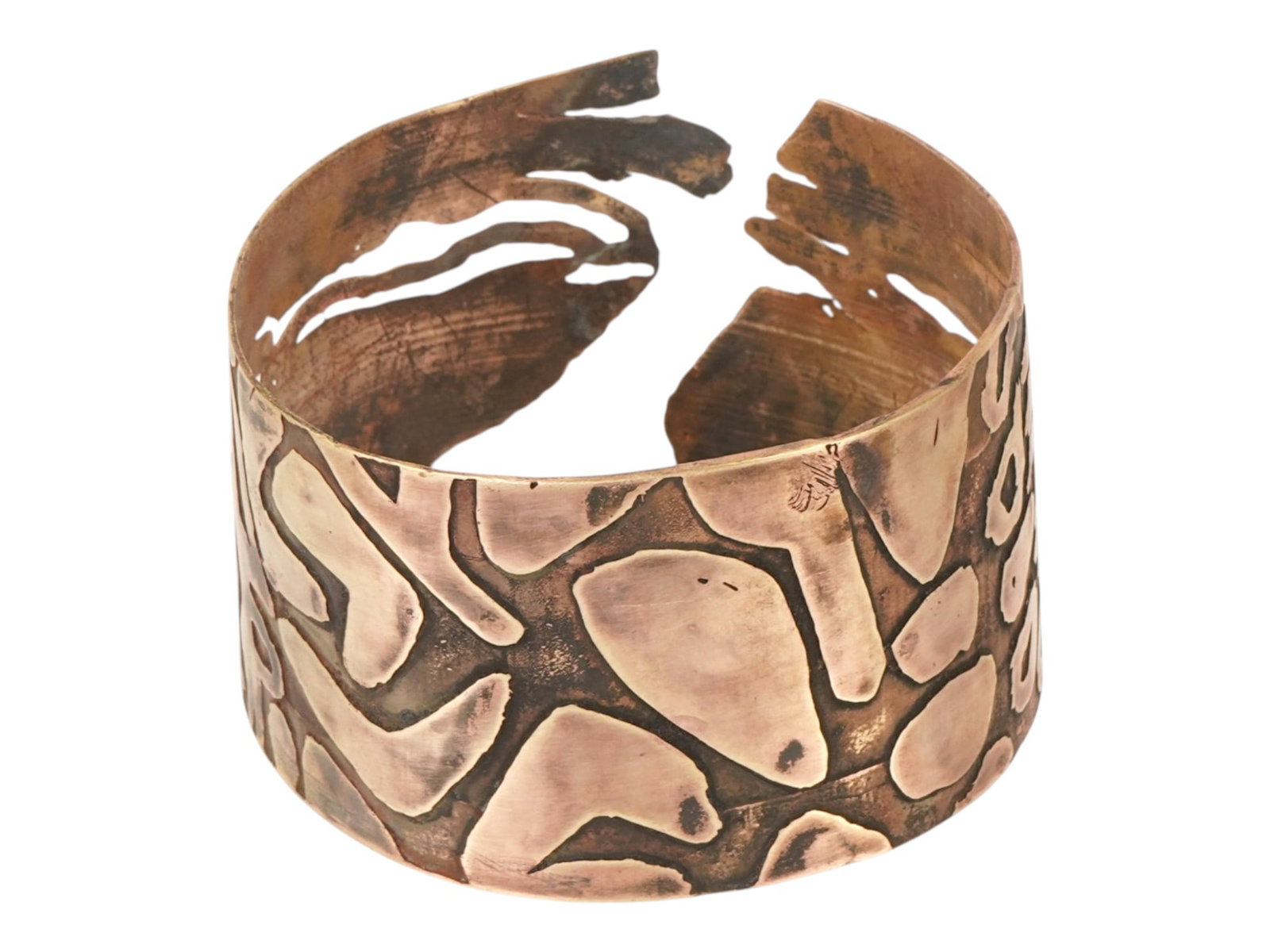 VINTAGE AEROSMITH COPPER CUFF BRACELET ETHNIC STYLE: A vintage Aerosmith copper cuff bracelet in an ethnic style. The bracelet is adorned with large, raised spots of various shapes and sizes. It is marked on the inside, Aerosmith. Vintage Bracelets And 