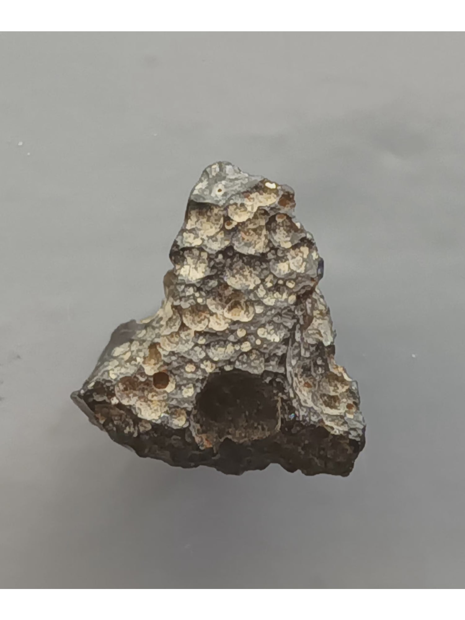 TEKTITE - FROM METEORITE IMAPCT: Pyramidal, pitted philippinite tektite. Chipped. Weight: 2.05 grams. Origin: Anda, Cabarruyan Isl. Pangasinan, Luzon, Philippines. (TE10/101) THIS LOT QUALIFIES FOR A 30-DAY UNCONDITIONAL RETU