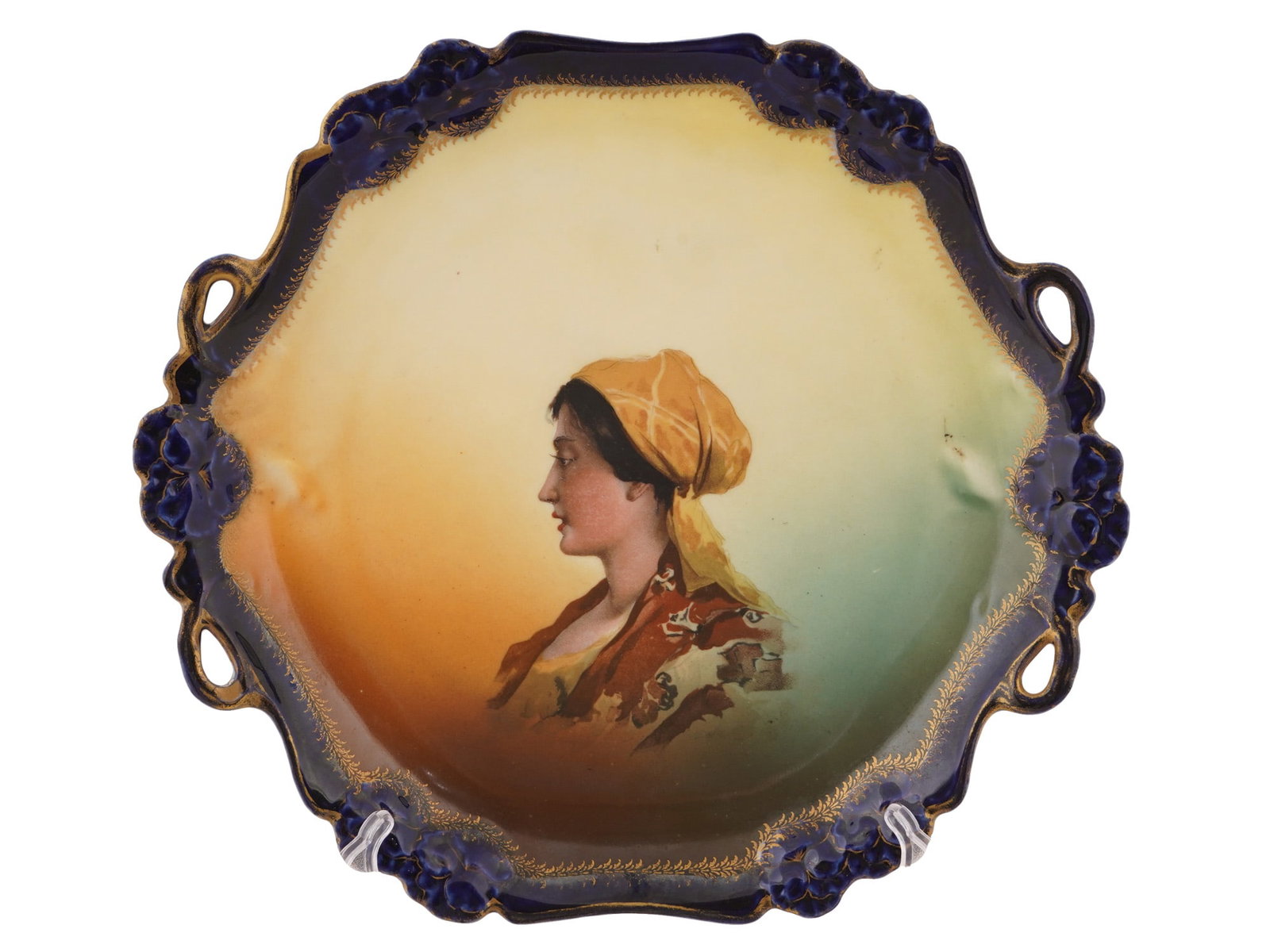 ANTIQUE GERMAN ROSENTHAL CHINA PORCELAIN PORTRAIT PLATE: An antique Rosenthal China porcelain portrait plate coming from the Pensee series produced in Bavaria, Germany, during the late 19th to early 20th century. The center features a finely executed portra