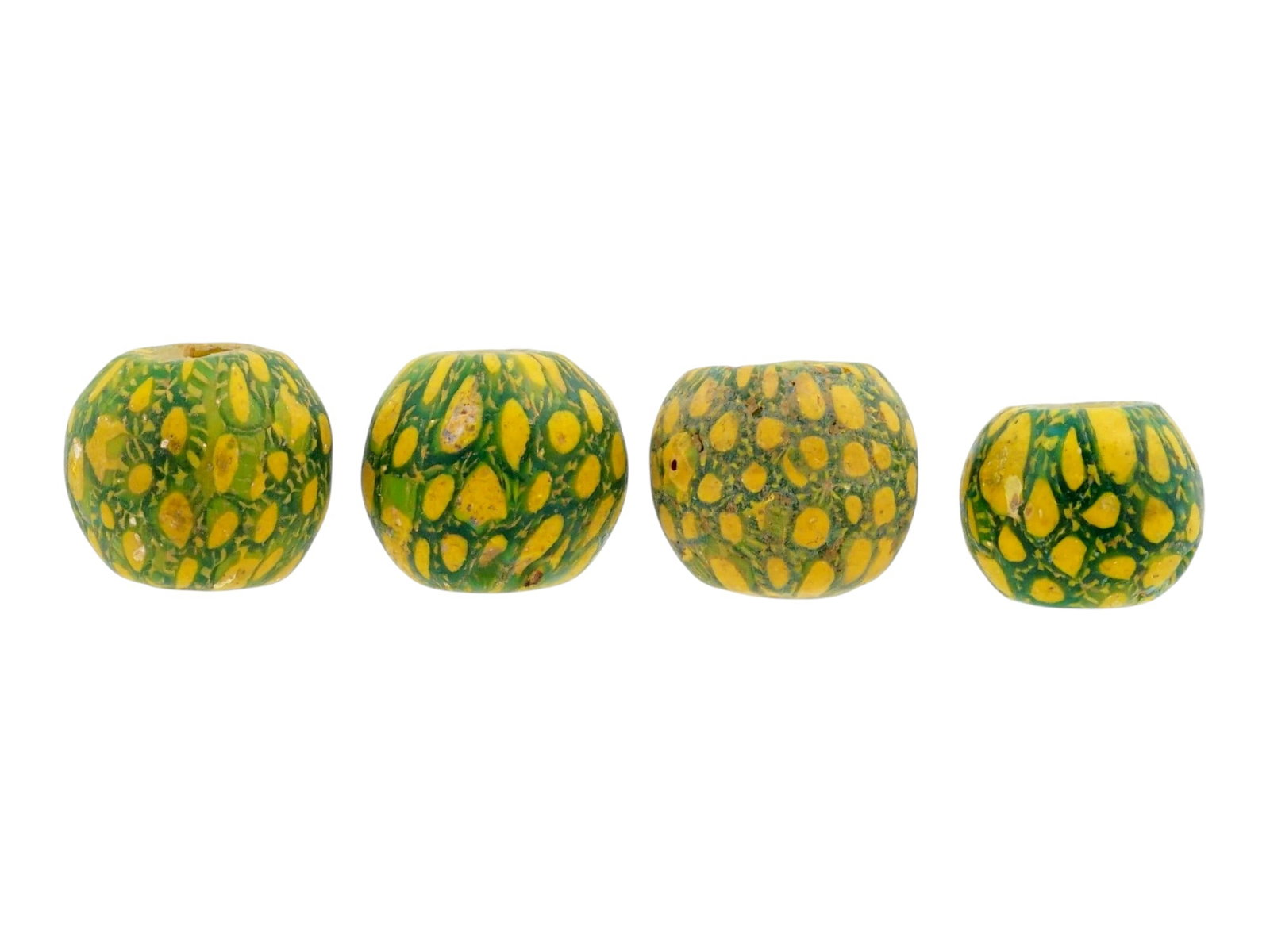 ANCIENT INDONESIAN MANIK JATIM MOSAIC GLASS BEADS: A group of four ancient Indonesian mosaic glass beads, known as Manik Jatim, dating approximately from 500 to 1000 AD and originating from Java during the pre-Islamic Hindu-Javanese period. Executed i