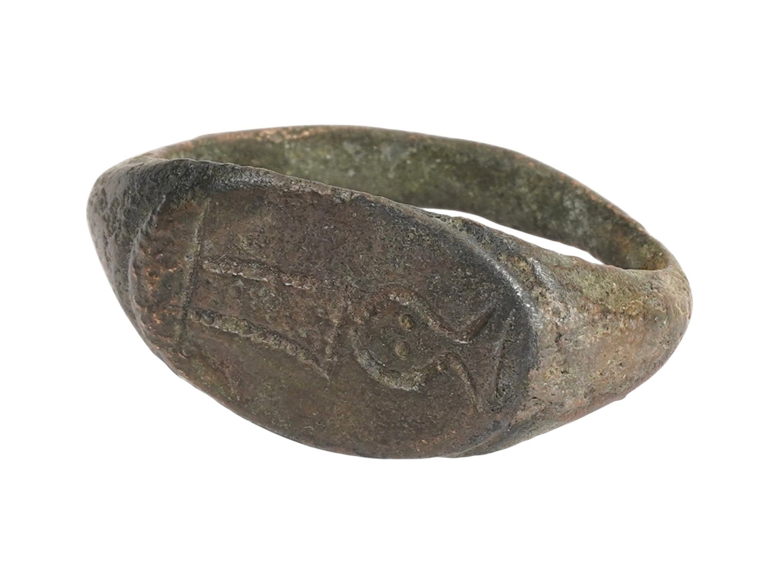 ANCIENT HOLY LAND BRONZE RING ENGRAVED W GOD BAAL: An ancient Holy Land bronze signet ring. The ring is adorned with an engraved design representing the god Baal with two horns. Circa 700 to 400 BC. Note: Baal was a major Semitic title and deity meani