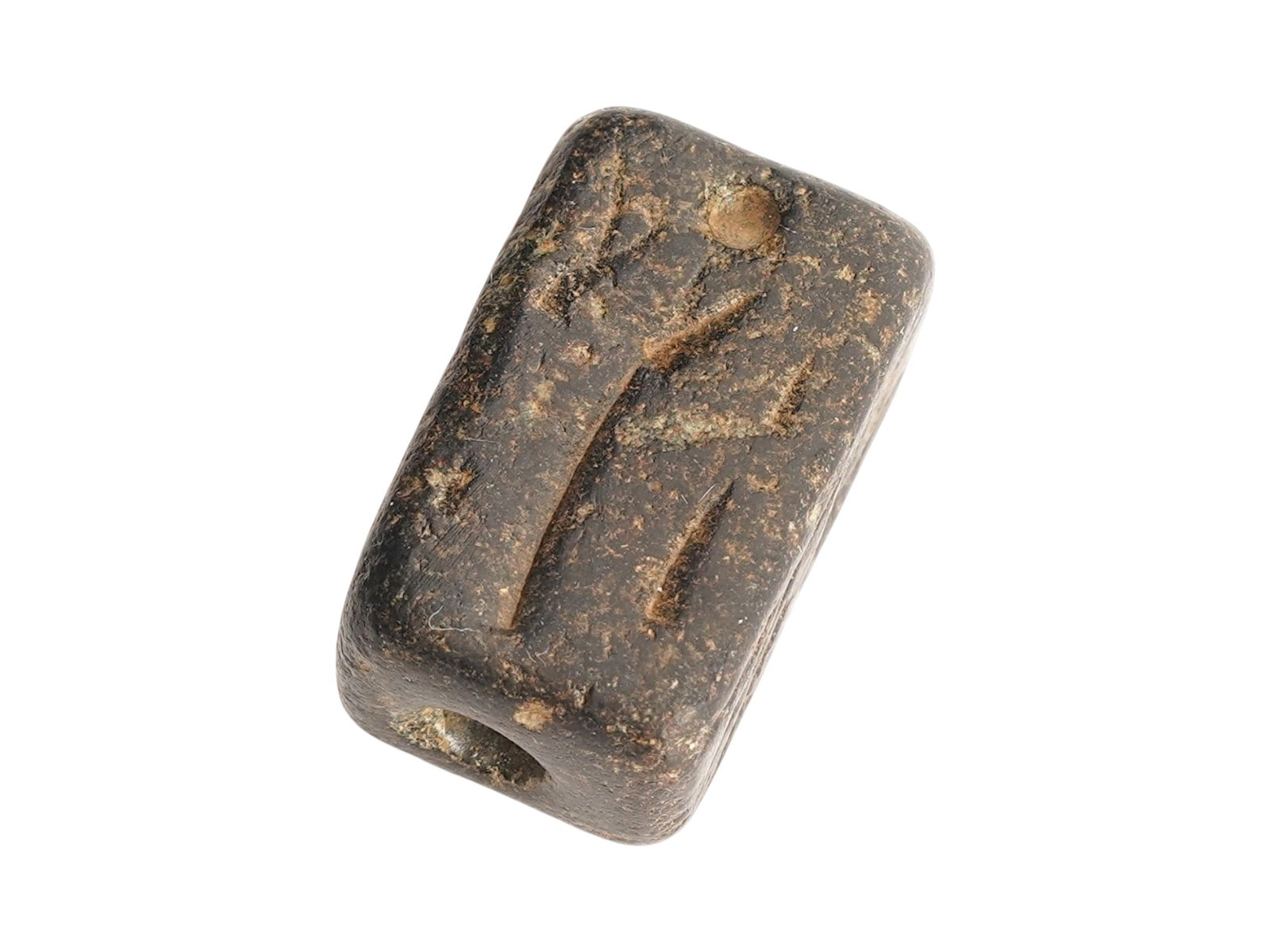ANCIENT HOLY LAND STEATITE BEAD SEAL 1ST MILLENNIUM BC: An ancient Holy Land hand carved Steatite stone bead seal, dating to the 1st millennium BC. The cylindrical shaped bead is engraved on four sides with an image representing animal and figures in the f