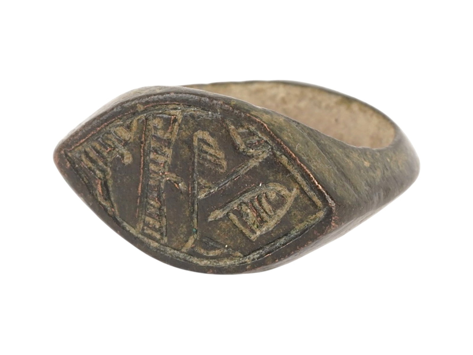 ANCIENT EGYPTIAN ENGRAVED BRONZE RING 200 TO 100 BC: An ancient Egyptian bronze signet ring. The ring is adorned with an engraved design representing traditional symbols. Circa: Late Period, 200 to 100 BC. Historical Finds And Archaeological Relics, Jew