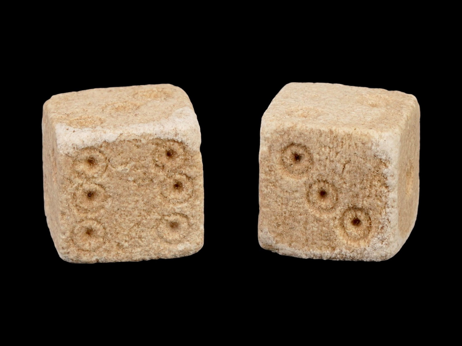 PAIR OF ANCIENT ROMAN STONE DICE 100 TO 300 AD: A pair of ancient Roman carved stone gaming dice. Imperial Rome era, circa 100 to 300 AD. Square shape. Archaeological Finds And Relics, Stone Carvings, and Collectibles. THIS LOT IS ELIGIBLE F