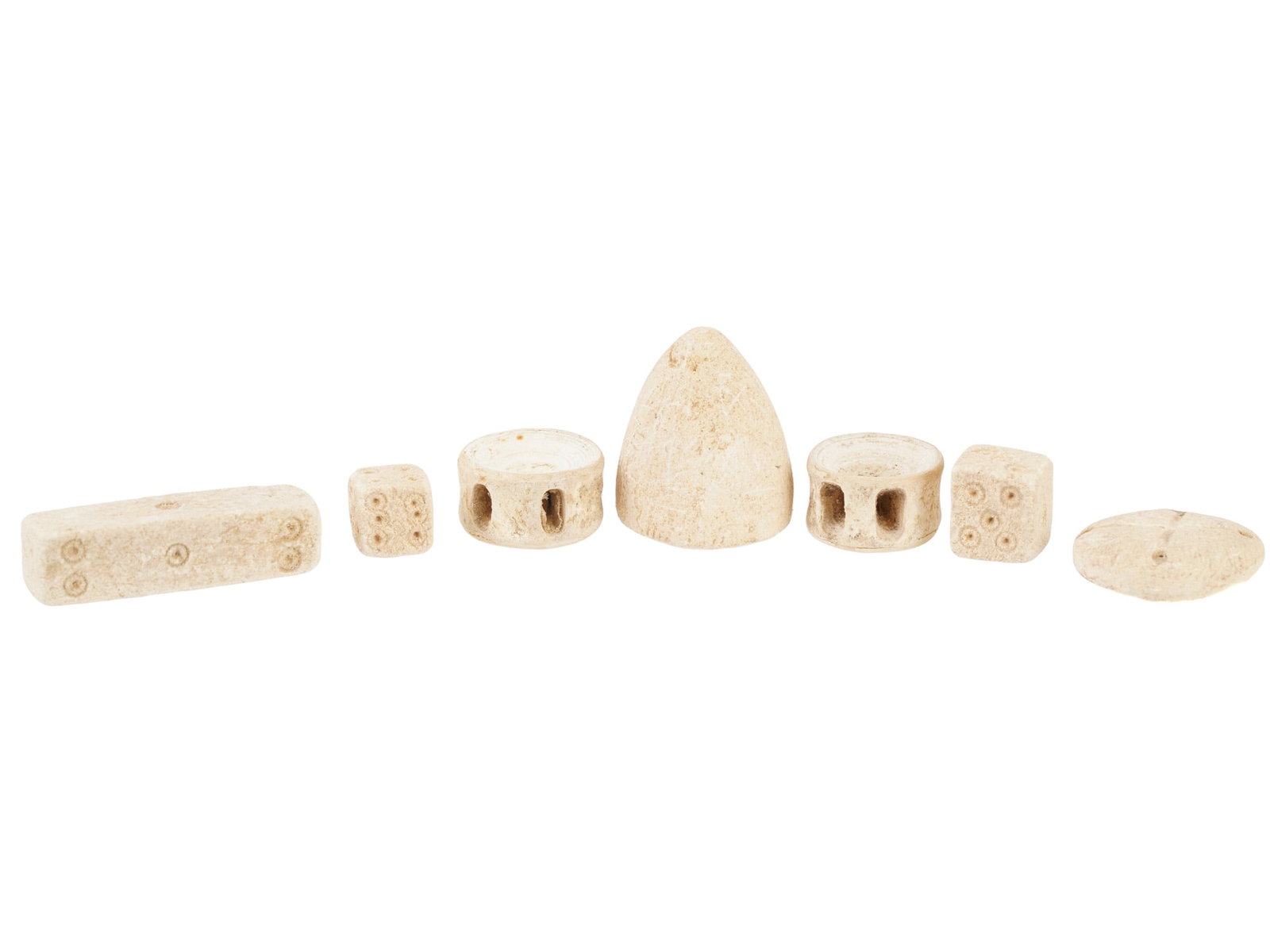 LOT ANCIENT GRECO ROMAN GAMING PIECES 1ST MILLENNIUM BC: A group of seven ancient Roman gaming pieces. Circa: 1st Millennium BC. The lot includes handcrafted gaming pieces, including dice of various shapes made from natural materials. Historical Collectible