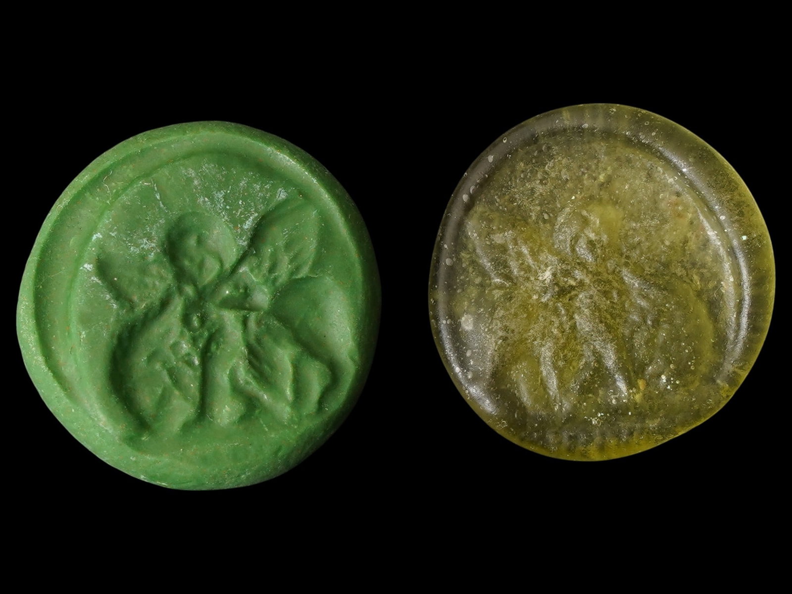 ANCIENT ROMAN GLASS MEDALLION W ANGEL IMAGE 100 TO 300AD: An ancient Roman glass medallion dating circa 100 to 300 AD, featuring an image of an angel riding a lion. The medallion showcases the artistry of Roman glassmakers, combining intricate design with fu