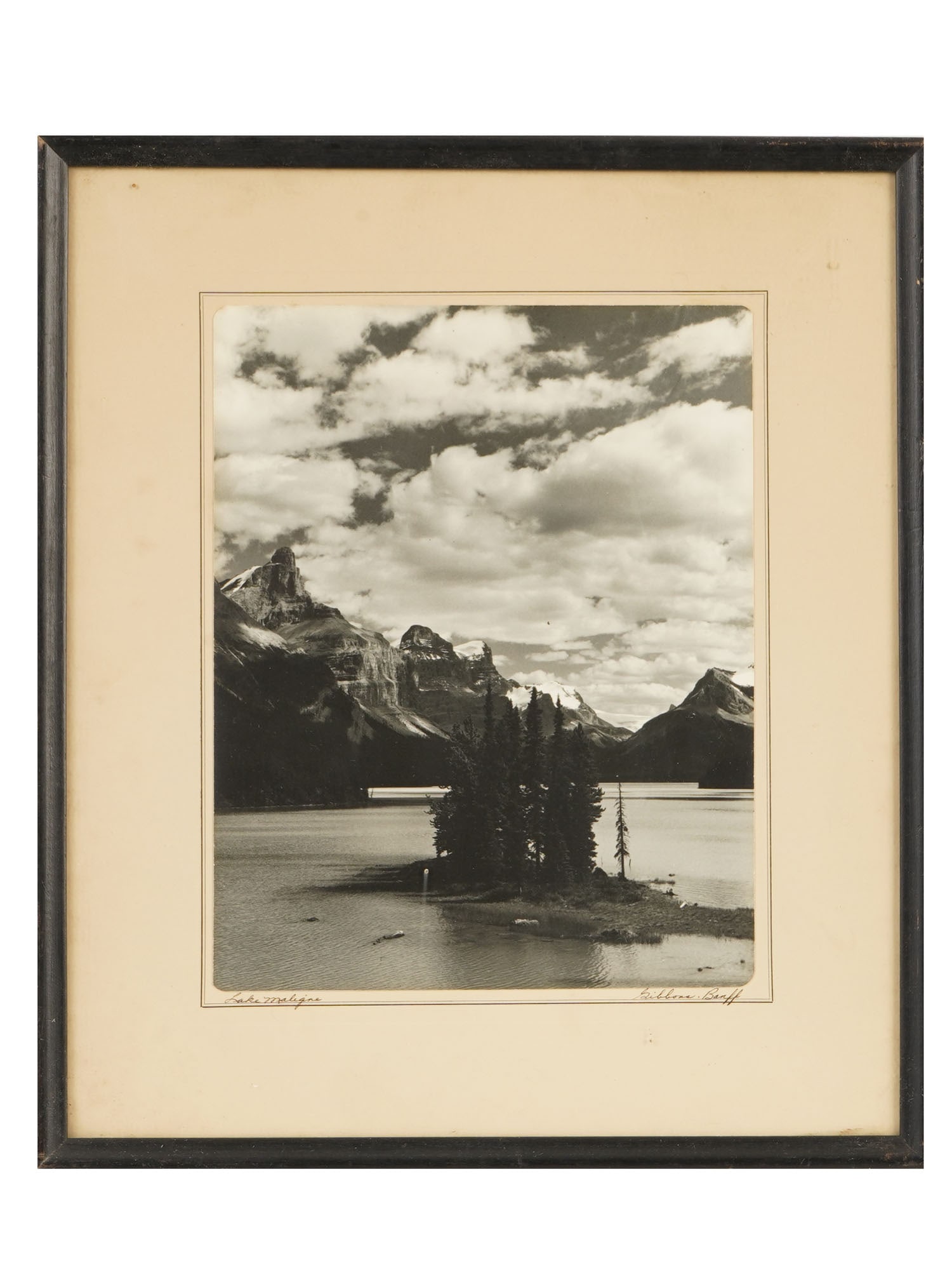 VINTAGE LANDSCAPE PHOTOGRAPH SPIRIT ISLAND MALIGNE LAKE: A vintage landscape photograph depicting the iconic view of Spirit Island at Maligne Lake in Jasper National Park. The composition captures the celebrated cluster of pine trees extending into the glac
