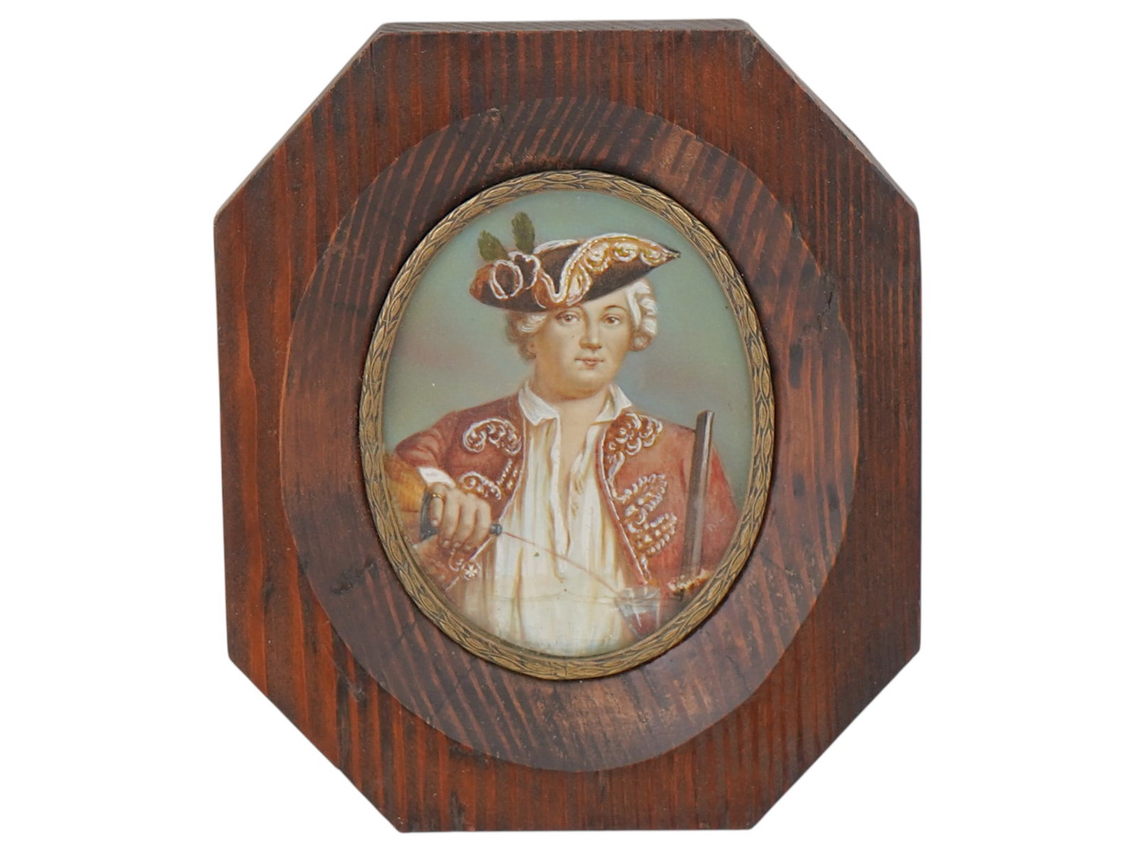 VINTAGE EUROPEAN MINIATURE PORTRAIT PAINTING: A miniature vintage European portrait painting. The oval painting in an oval wooden frame depicts a young nobleman dressed in 18th century fashion pouring a drink into a glass. Collectible Fine Art, P