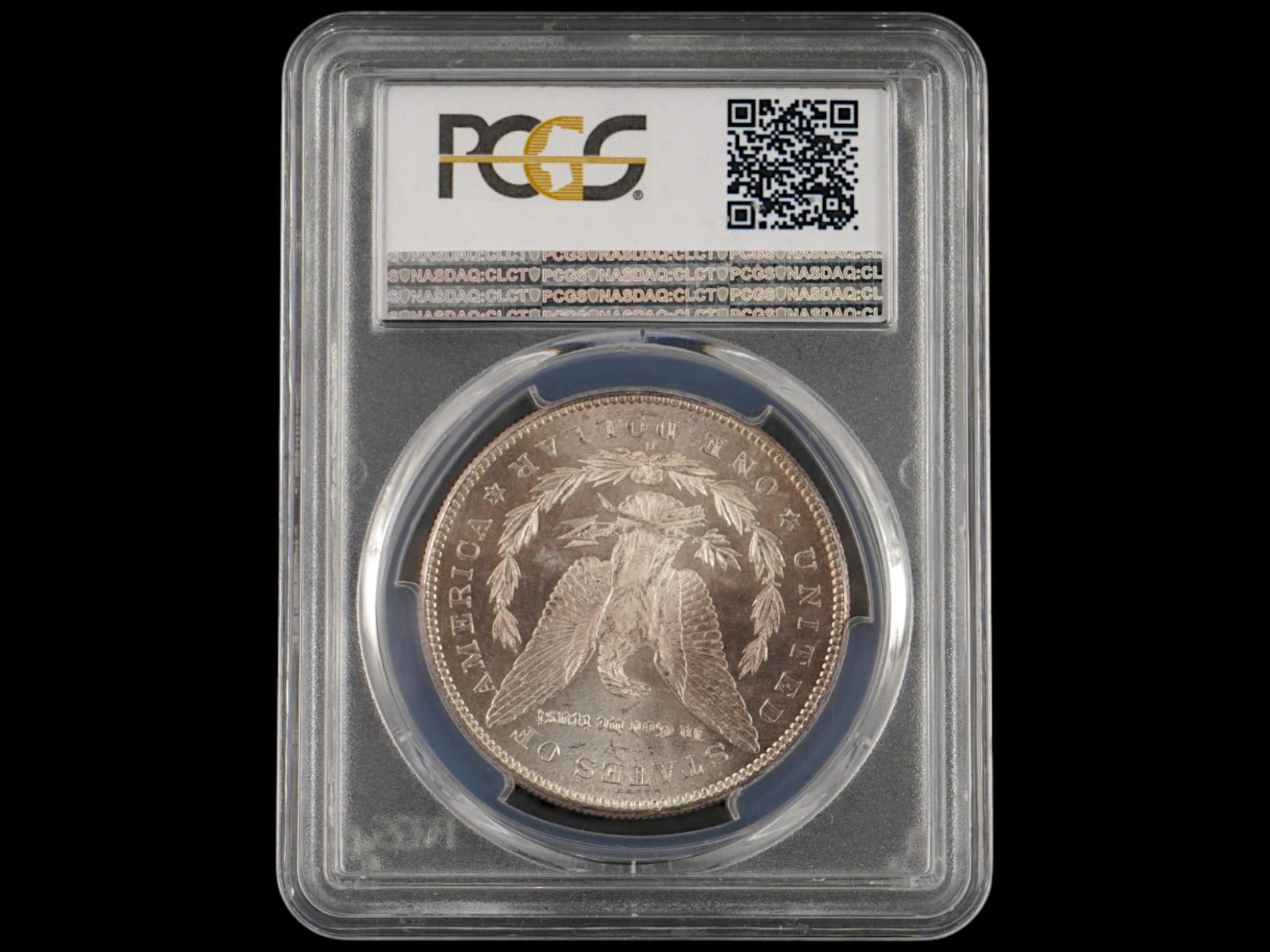 ANTIQUE AMERICAN 1878 S MORGAN SILVER DOLLAR GRADED: An antique American 1878-S Morgan Silver Dollar graded MS63 by Professional Coin Grading Service, featuring exceptional rainbow toning with vibrant shades of purple and blue across the surfaces. Struc