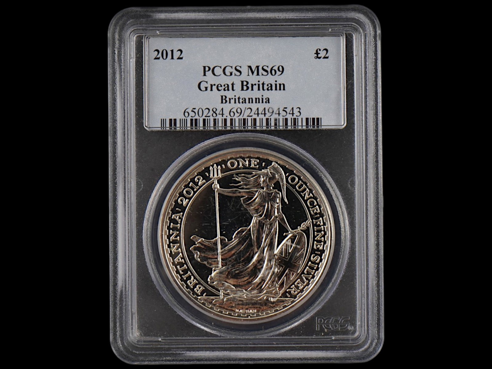 2012 GREAT BRITAIN BRITANNIA SILVER COIN GRADED PCGS: A 2012 Great Britain Britannia silver coin graded MS69 by Professional Coin Grading Service. Featuring the iconic figure of Britannia, a timeless symbol of British strength and heritage. British Silve