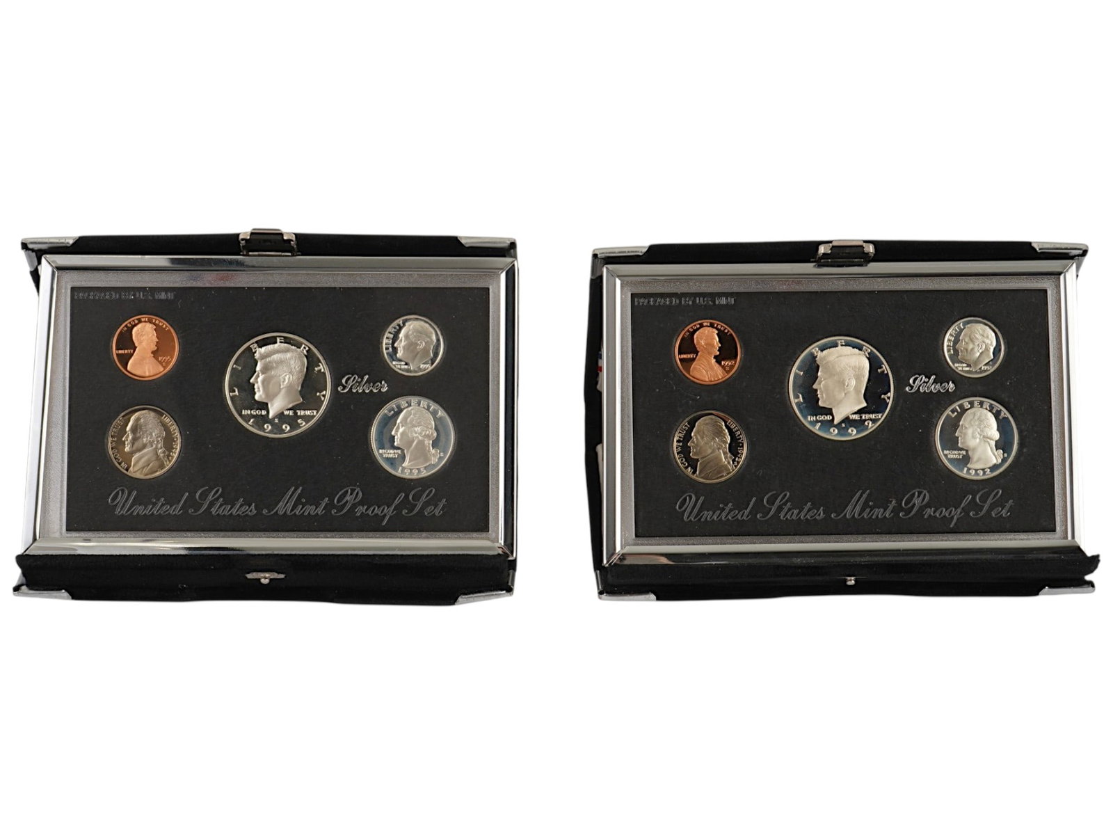 1992 1995 UNITED STATES MINT PREMIER SILVER PROOF SETS: A collection of two United States Mint Premier Silver Proof Sets from 1992 and 1995, each accompanied by its original Certificate of Authenticity and presented in the original Mint packaging. Though t