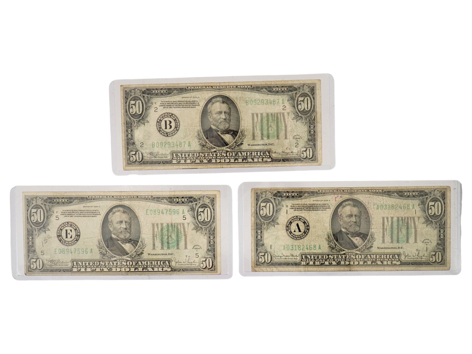 AMERICAN CURRENCY 50 DOLLARS NOTES FROM 1934: A lot of three American 50 Dollars banknotes from 1934. A total of 150 Dollars of United States Note or a Federal Reserve Note with a green seal. The lot includes banknotes of series A, B, E with a po