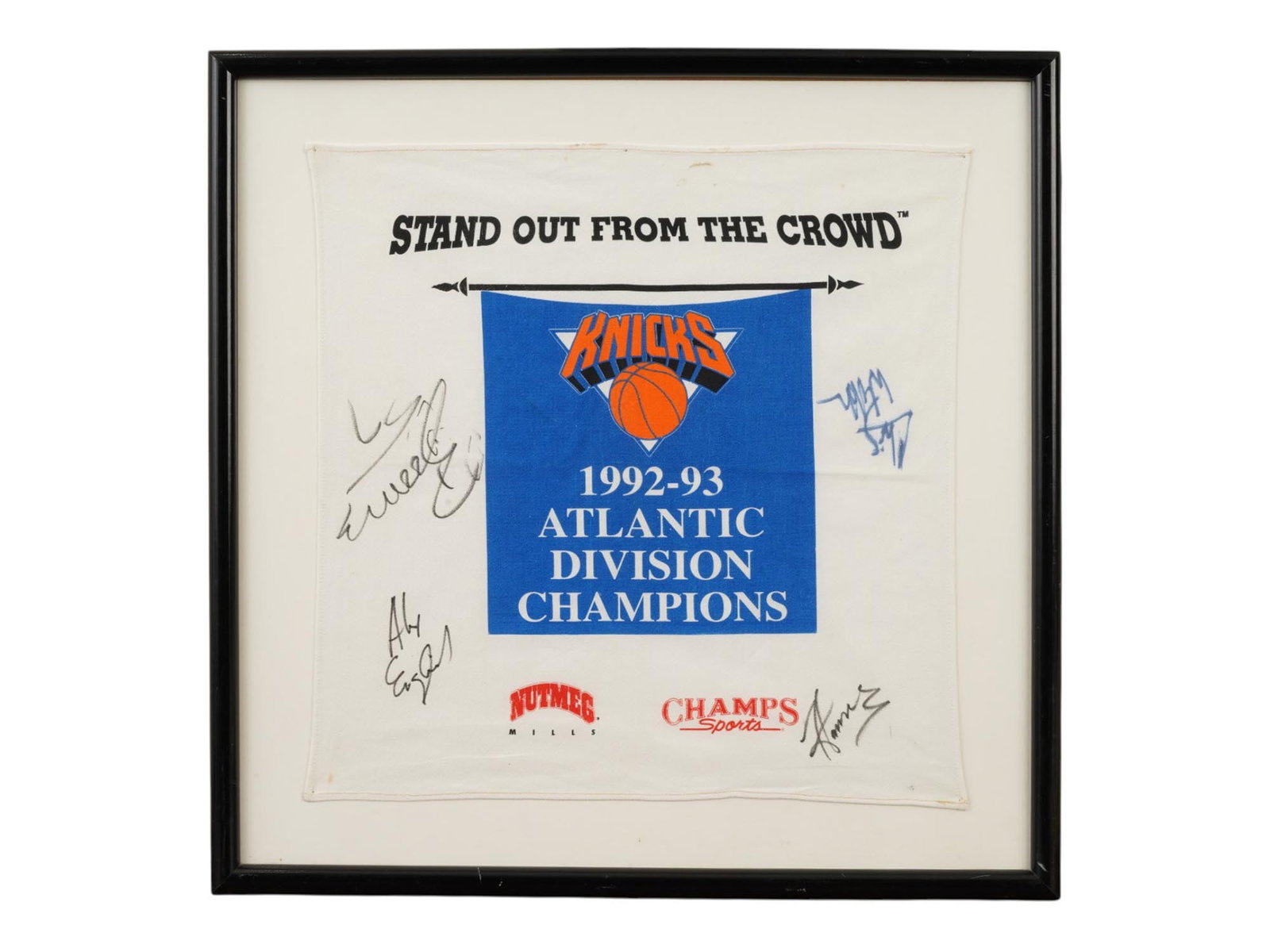 FRAMED 1993 NY KNICKS MULTI SIGNED ATLANTIC DIVISION BANNER: This framed textile banner commemorates the New York Knicks as the 1992-93 Atlantic Division Champions, featuring the official team logo alongside Nutmeg Mills and Champs Sports branding. The