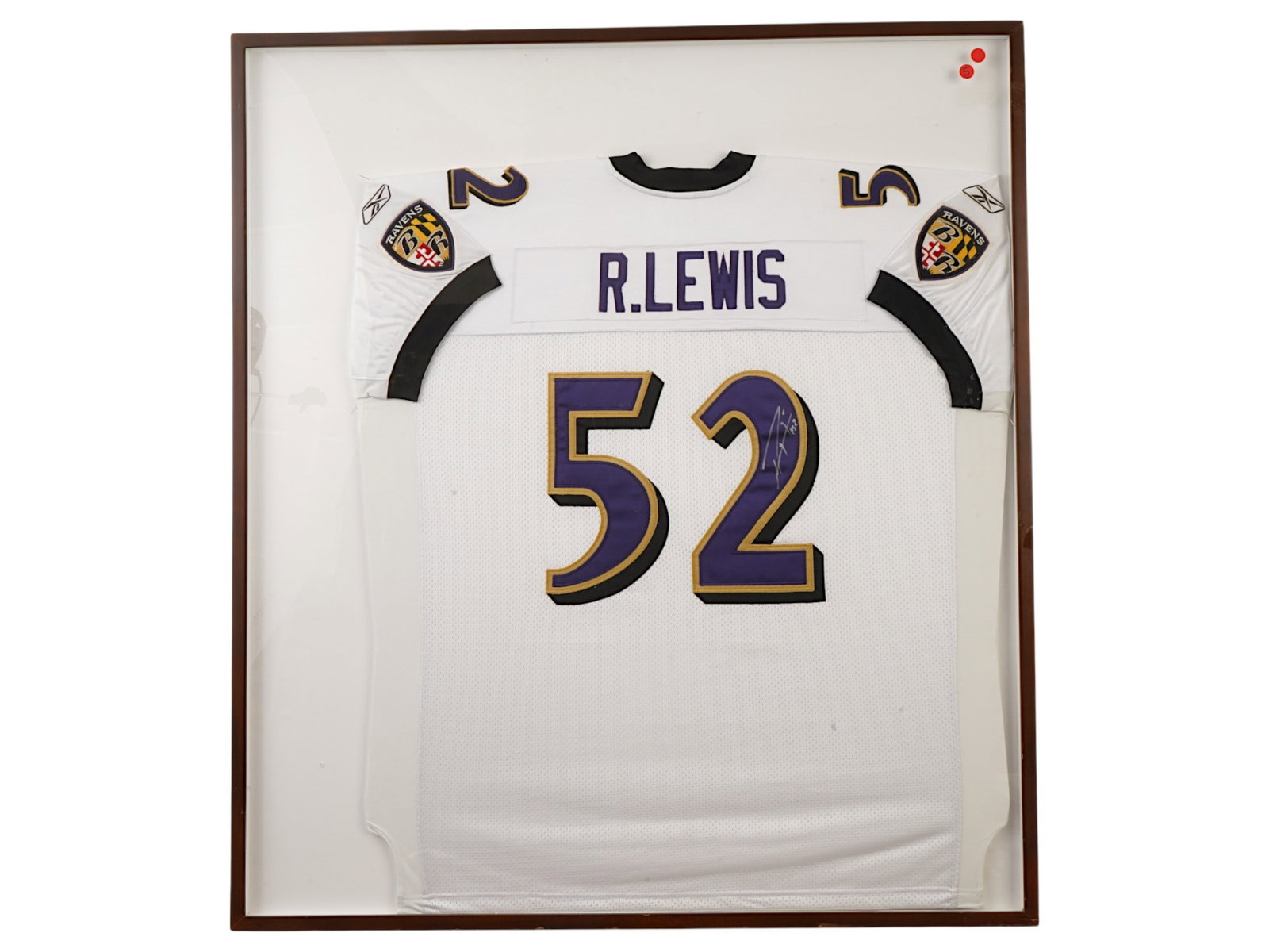 RAY LEWIS SIGNED BALTIMORE RAVENS FRAMED JERSEY: A Baltimore Ravens jersey hand-signed by Hall of Fame linebacker Ray Lewis. The piece is custom-framed, making it a ready-to-hang centerpiece for any sports memorabilia collection. NFL, Ravens, Lineba