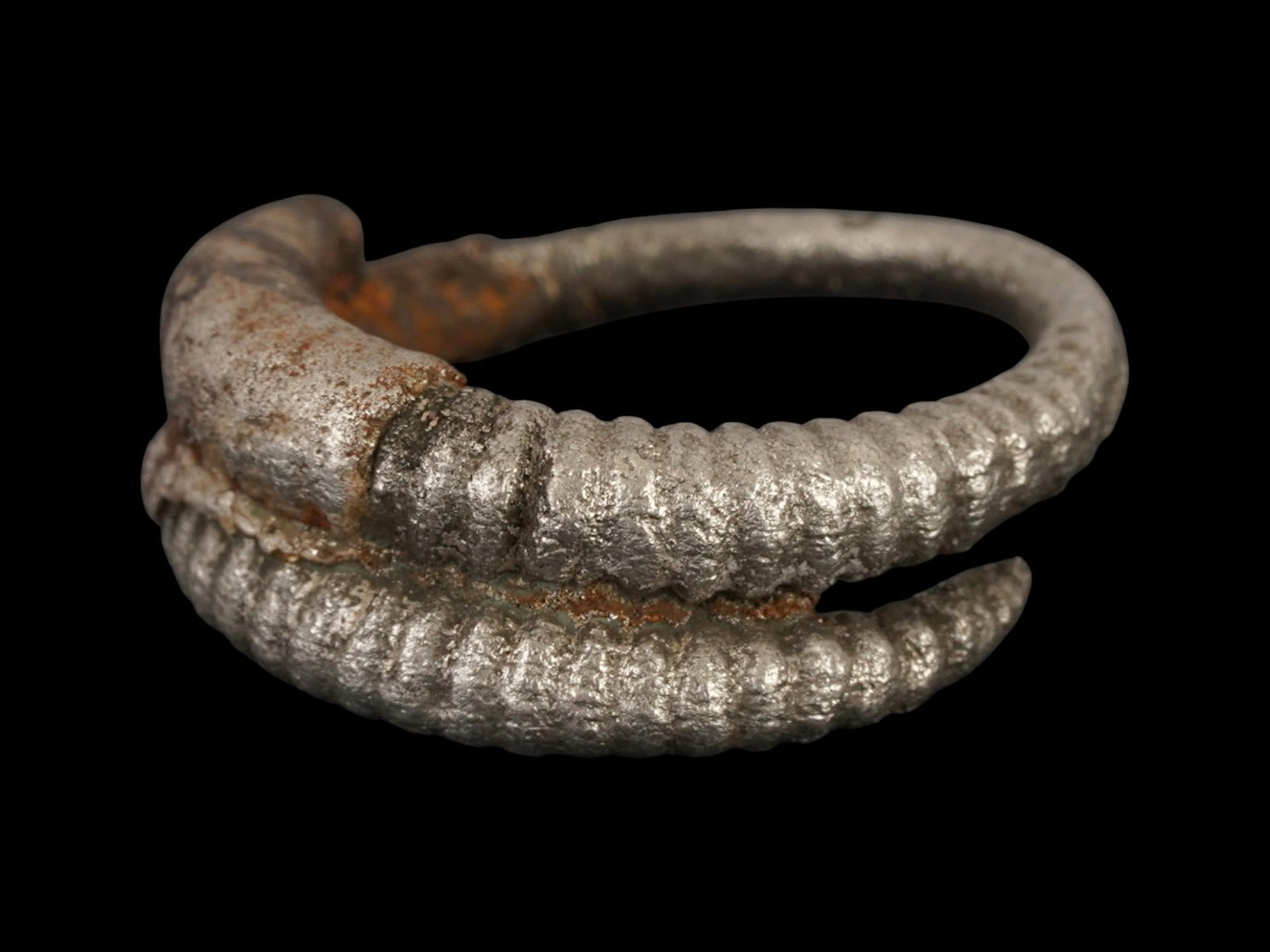 ANCIENT EGYPTIAN LATE PERIOD SILVER HAIR BAND: An ancient Egyptian silver hair band. Late Period, 26th Dynasty to Ptolemaic Egypt, ca. 700 to 200 BC. The ware is made in a spiral design. Total Weight: 4.5 g. Collectible Historical Relics And Archa