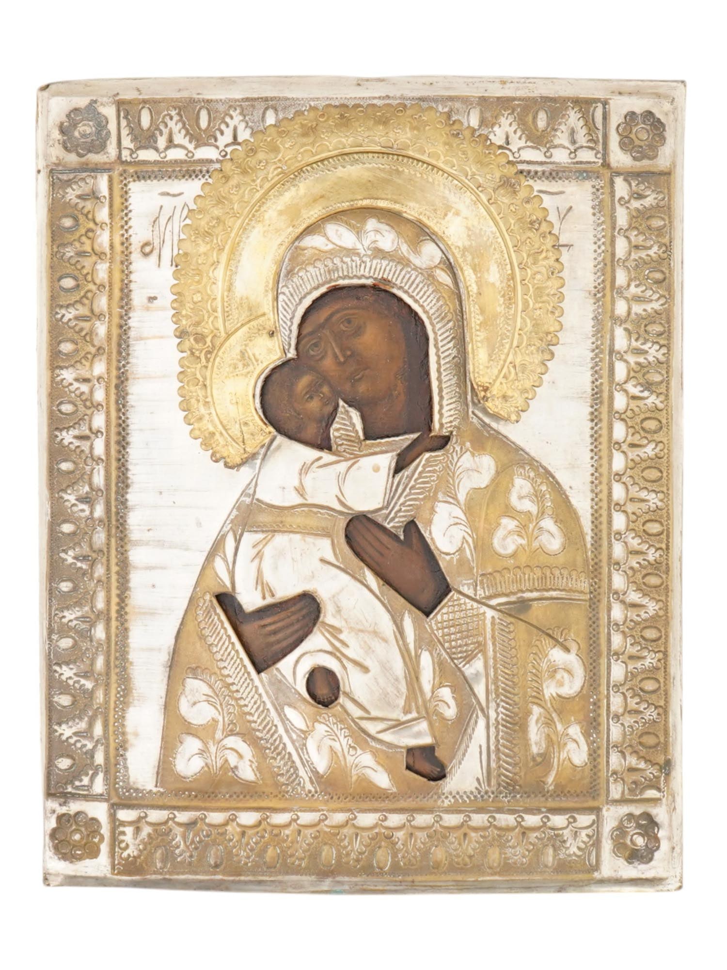 ANTIQUE 19TH C RUSSIAN ICON VLADIMIR MOTHER OF GOD: An antique 19th-century Russian Orthodox icon of Vladimir Mother of God. Mixed media painting: egg tempera, gesso, and levkas on a wood board. Enclosed in chased brass riza or oklad. Inscriptions in R