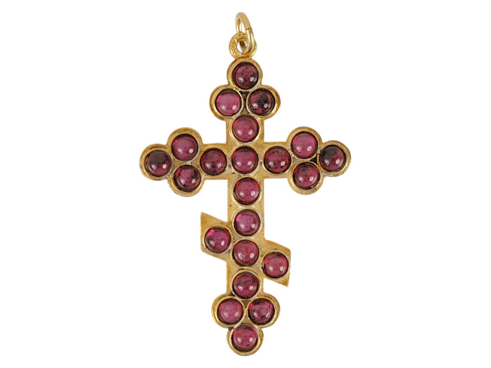 RUSSIAN SILVER ORTHODOX CRUCIFIX CROSS PENDANT GARNETS: A Russian gilt silver Orthodox crucifix cross pendant set with cabochon cut garnets throughout the front side. Hallmarked on the fitting ring with the 88 Russian Imperial silver standard and makers ma