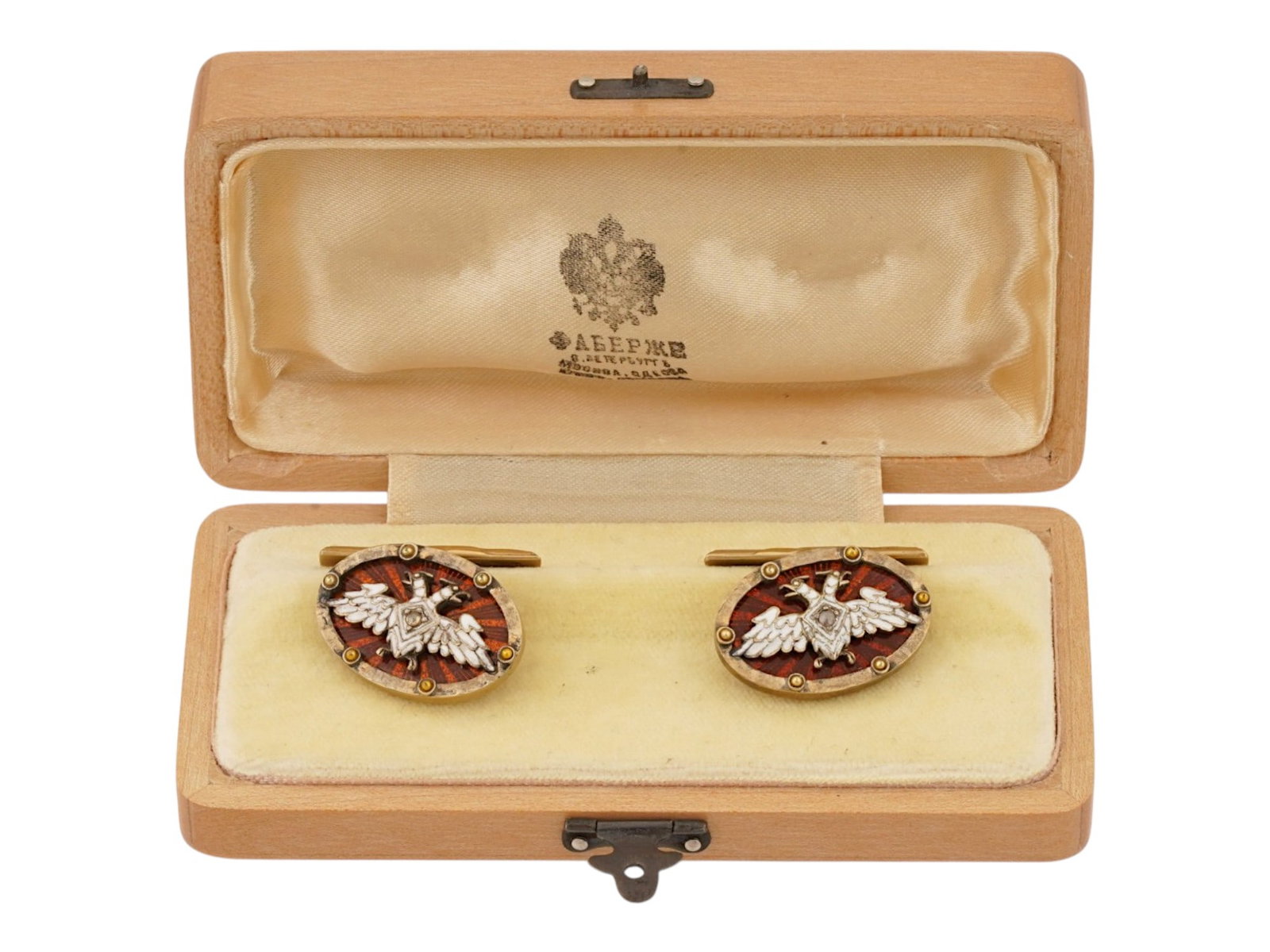 RUSSIAN 88 GILT SILVER ENAMEL DIAMONDS CUFFLINKS: A pair of Russian gilt silver enamel cufflinks. Each features an oval face adorned with cherry red enamel over a guilloche ground, and featuring an Imperial double-headed eagle overlay set with a diam