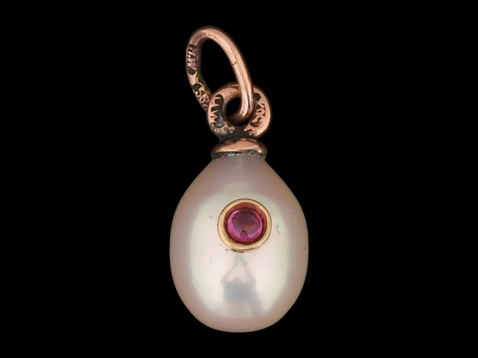 RUSSIAN 14K GOLD AND PEARL EASTER EGG PENDANT W RUBY: A Russian Pearl Easter egg pendant featuring 14K pink Gold fittings. The ware is encrusted with a Ruby stone in a Gold setting, on the front. Hallmark of 56 gold standard and makers mark are on the fi