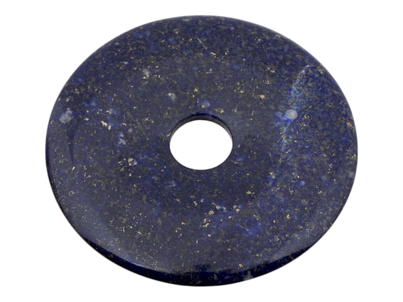 DISK SHAPED LAPIS LAZULI GEMSTONE BEAD: A flat, disk shaped bead made of lapis lazuli. The stone is deep blue in color and has characteristic golden flecks of pyrite scattered throughout. The disk has a hole in the center. Vintage and Moder