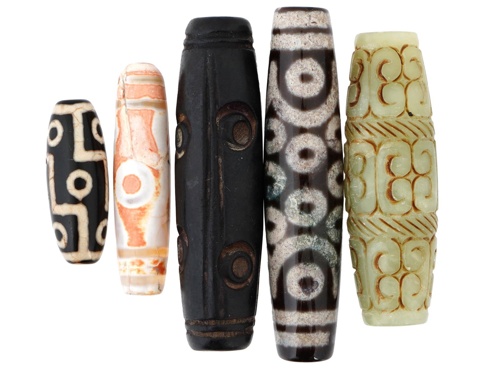 ANTIQUE TIBETAN JADE DZI BEADS WITH DIFFERENT SIZES: A group of five antique Tibetan jade and agate Dzi beads, each bearing a unique and intricate pattern that tells its own story of history and symbolism. These beads, cherished for centuries for their 