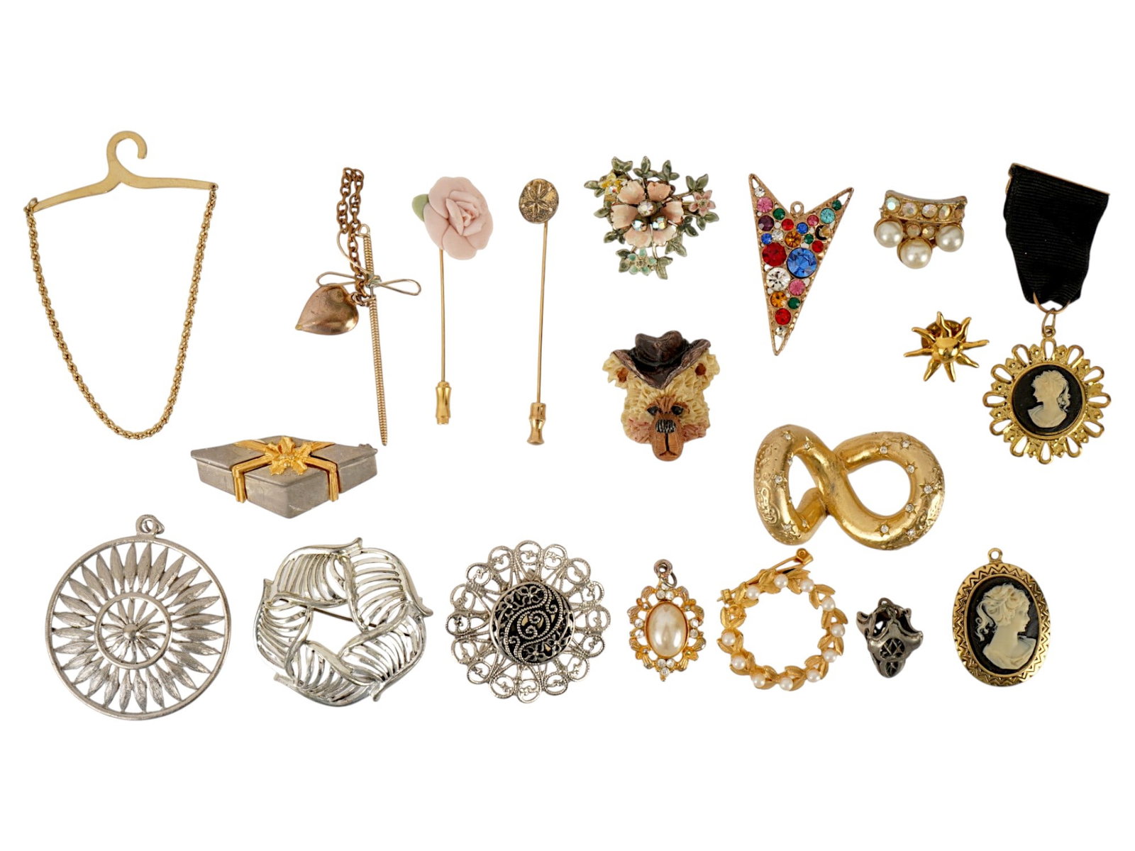 VINTAGE COSTUME JEWELRY STICK PINS CAMEOS BROOCHES: A collection of vintage costume jewelry dating from the late 20th century, featuring a mix of forms including stick pins, cameos, and figural brooches in gold- and silver-tone finishes. Highlights inc