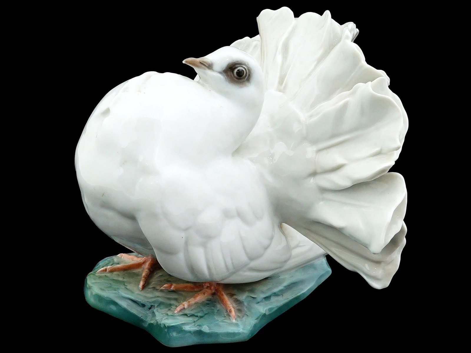 ANTIQUE GERMAN ROSENTHAL PORCELAIN PIGEON FIGURINE: An antique German Rosenthal porcelain figurine of a pigeon, designed by Fritz Heidenreich. The figurine is mostly white with colored beak, eyes and legs, standing on the green base. The base is