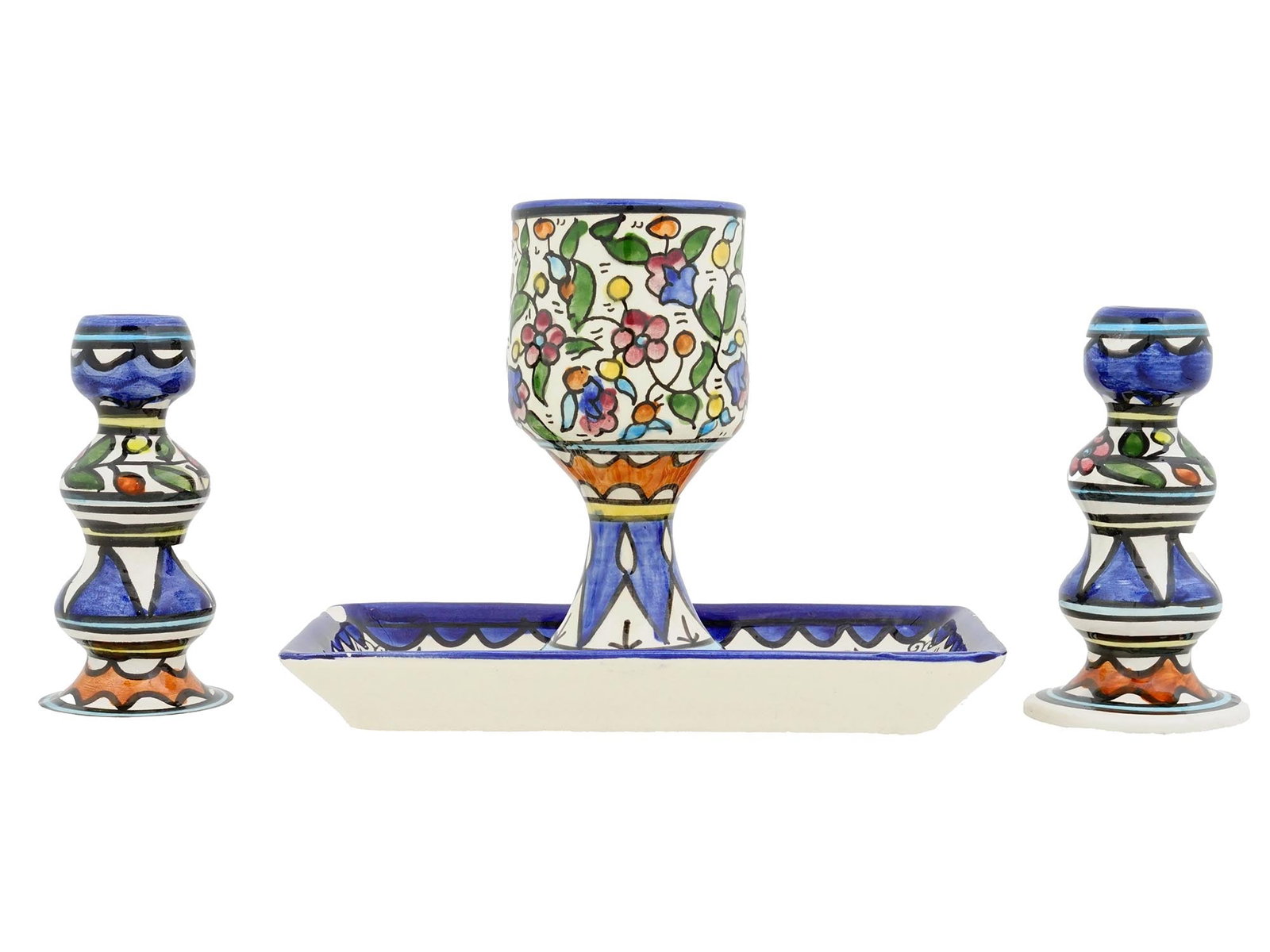 VTG ARMENIAN JUDAICA SHABBAT KIDDUSH CUP CANDLESTICKS: A vintage Armenian Judaica Shabbat set, comprising a Kiddush cup on a matching tray and a pair of candlesticks. Hand-painted in ceramic with characteristic motifs, the set features vibrant colors and 