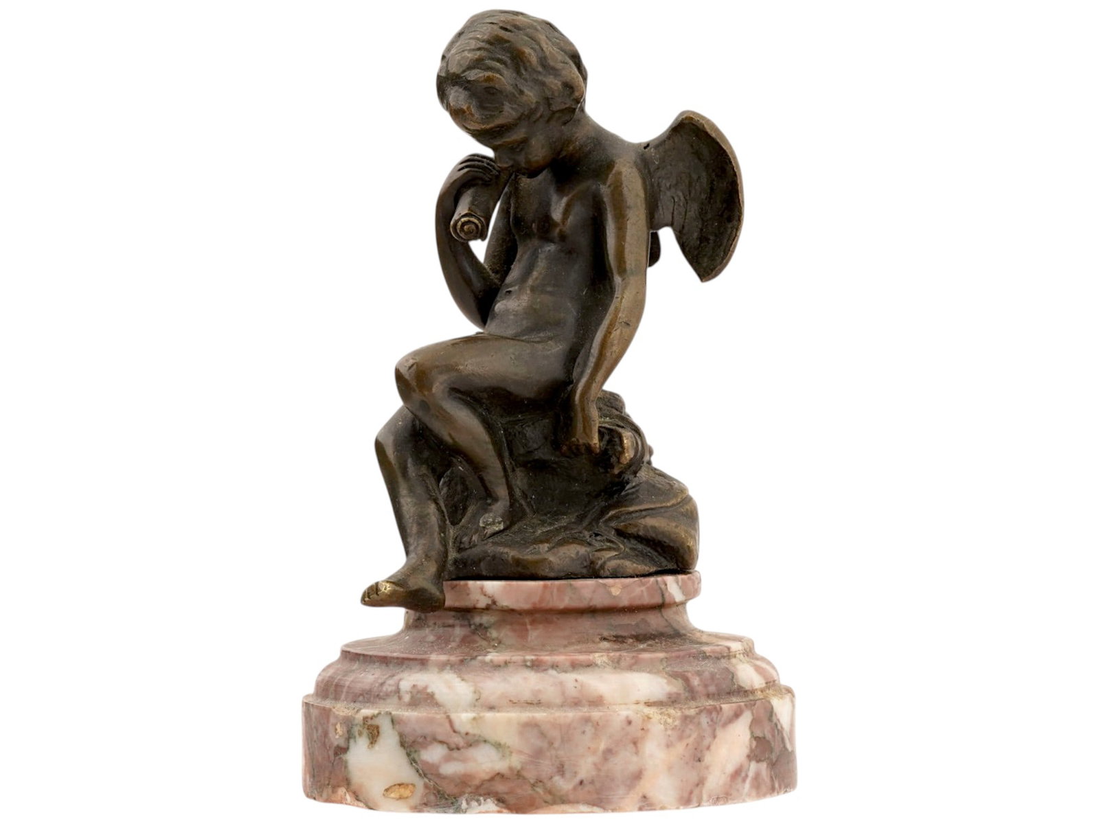 ANTIQUE NEOCLASSICAL CAST BRONZE CUPID SCULPTURE: An antique Neoclassical cast bronze sculpture. A figure of a seated cupid with a paper scroll. Mounted on the stepped stone, presumably pink marble, base. Brown patina. Unmarked. Collectible Sculpture
