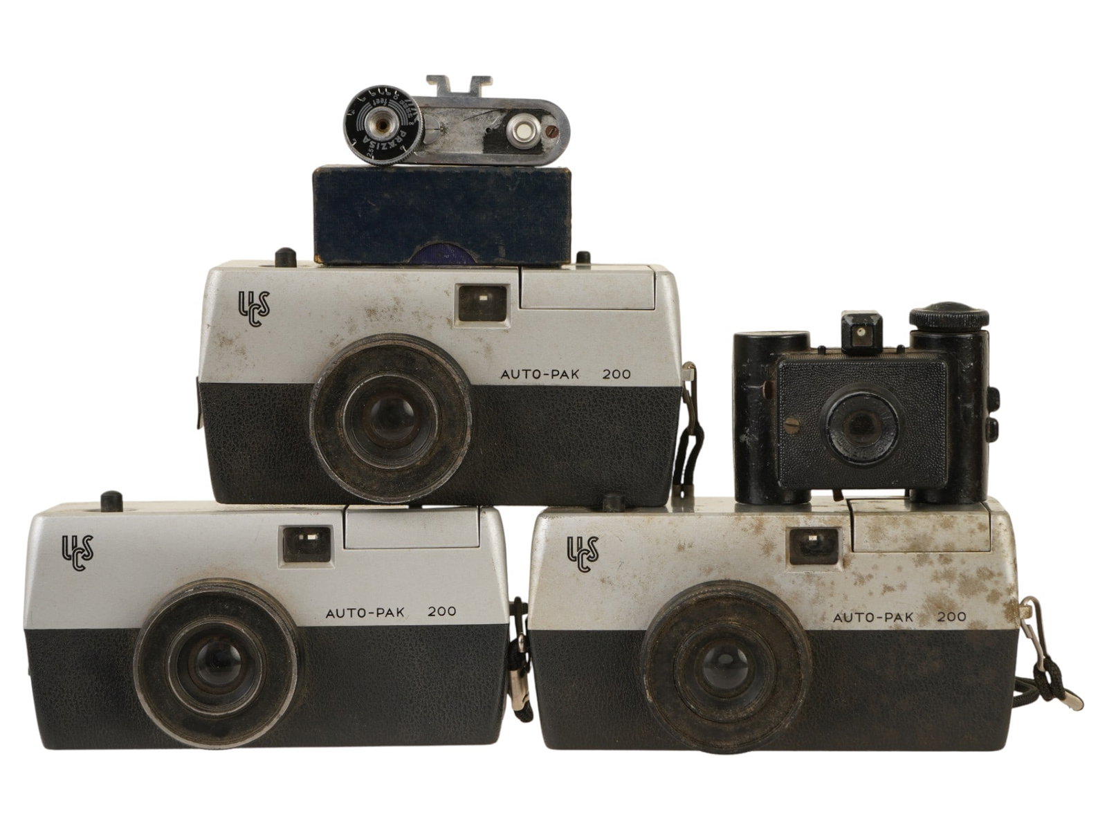 LOT OF VINTAGE USC AND PRAZISA FILM CAMERAS: A lot of vintage American and German film cameras. Three USC Auto-Pak 200 cameras. Sida Optik camera. Prazisa auxiliary rangefinder, in original box. Collectible Vintage Photo Cameras, Film Photograph