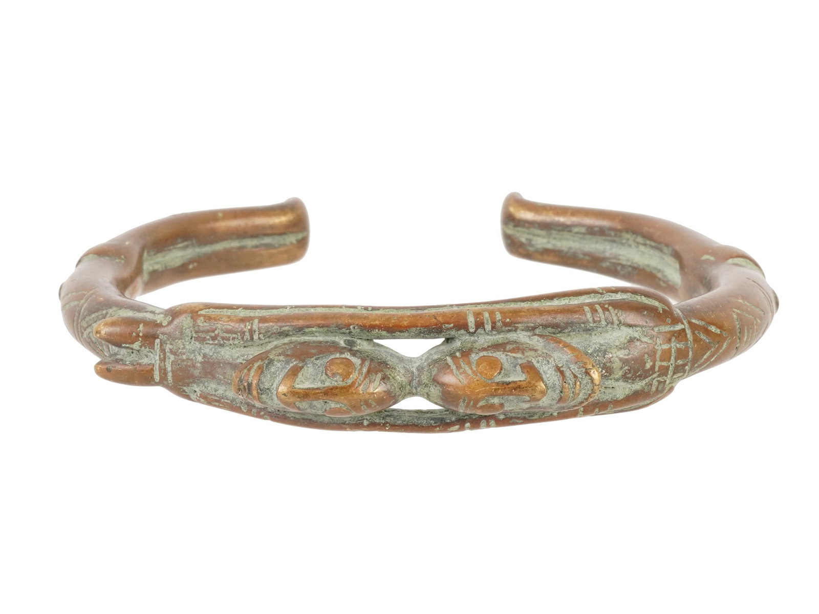 AFRICAN CAST BRONZE OPEN ENDED BANGLE BRACELET: An African open-ended bangle bracelet is crafted from cast bronze alloy, featuring two stylized human figures. Characterized by a heavy, solid construction, the piece displays a complex surface textur